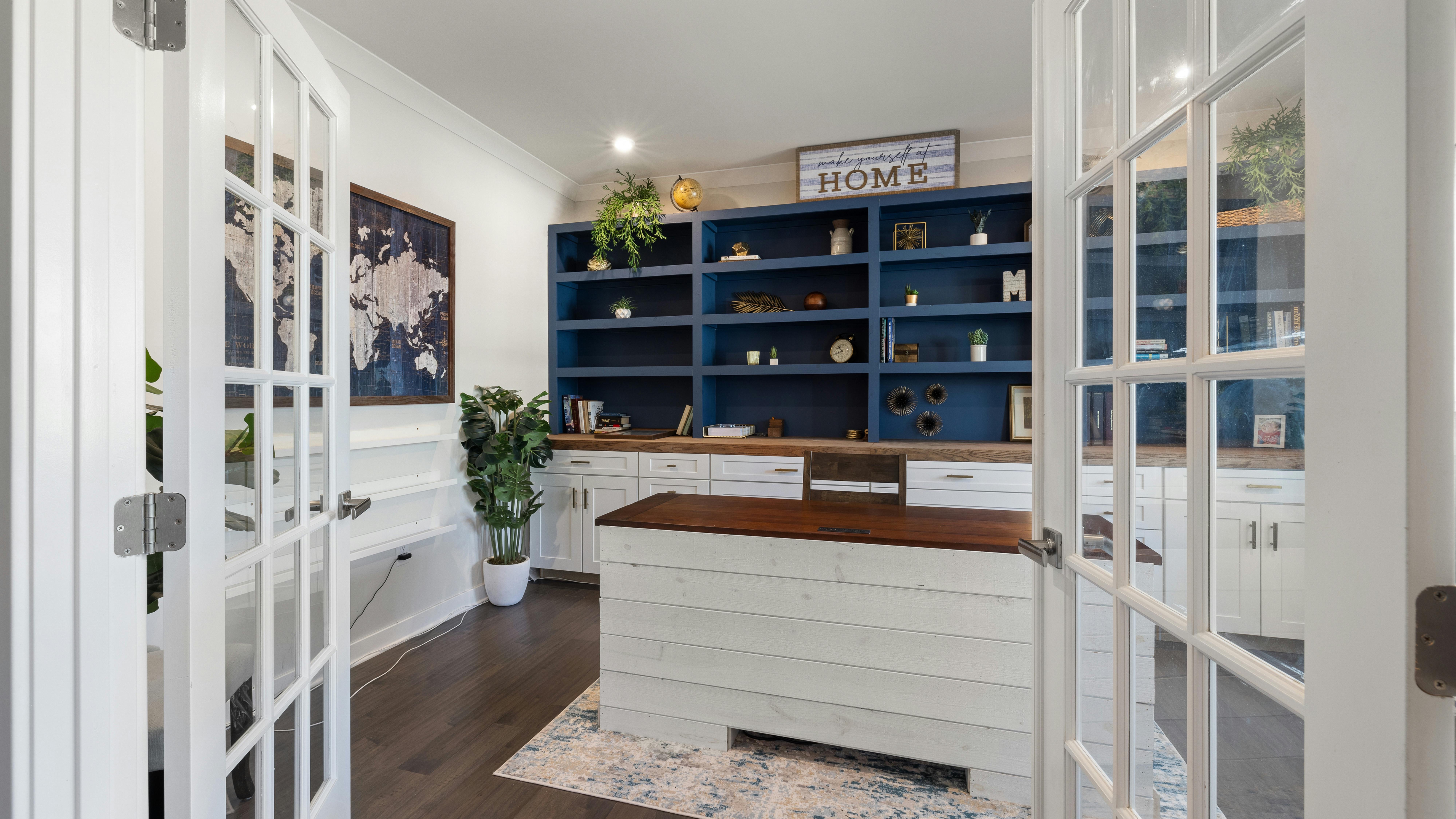 Vintage home office with bookshelf and classic decor.