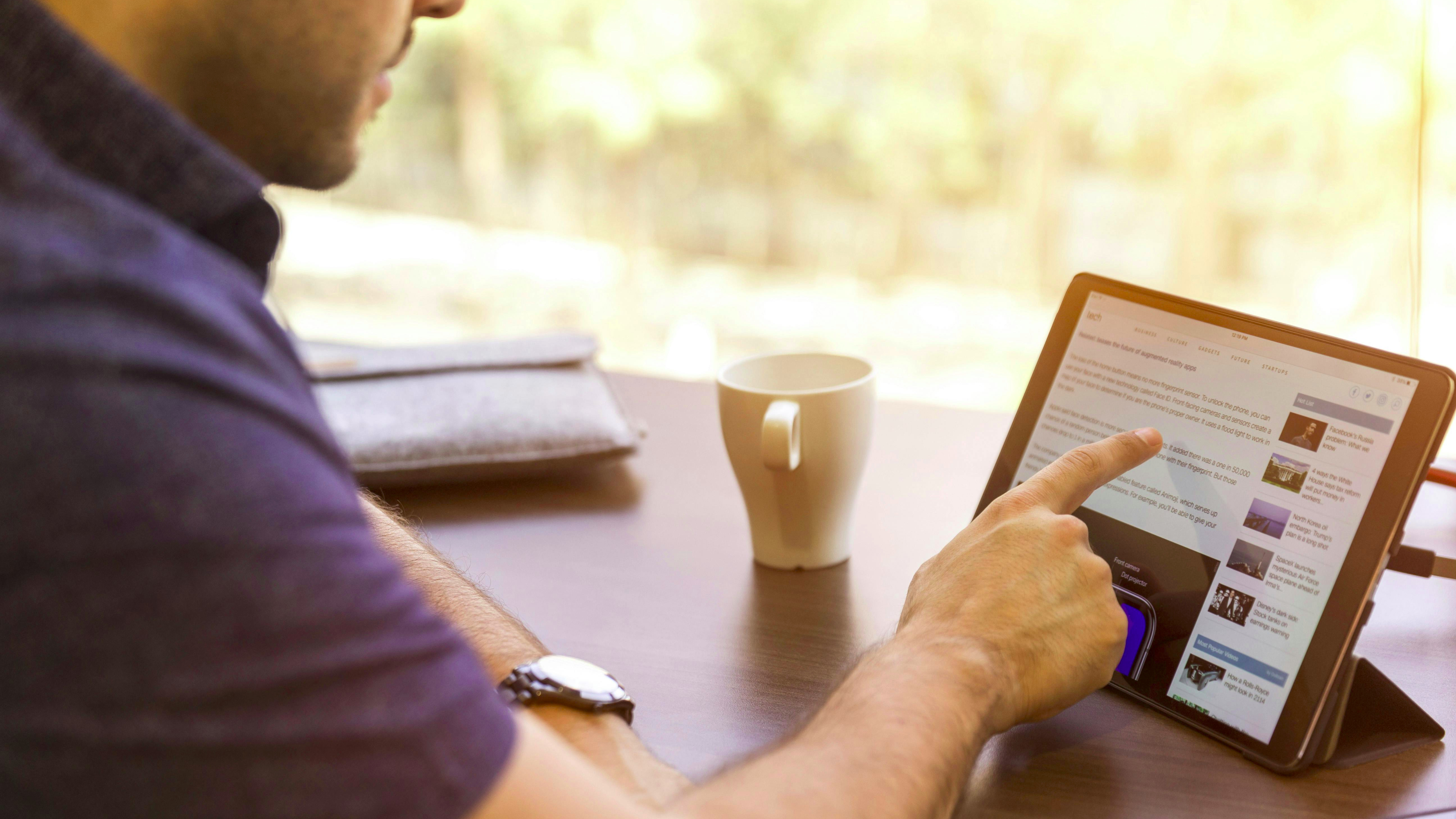 Smart home control in a modern kitchen with sleek design.