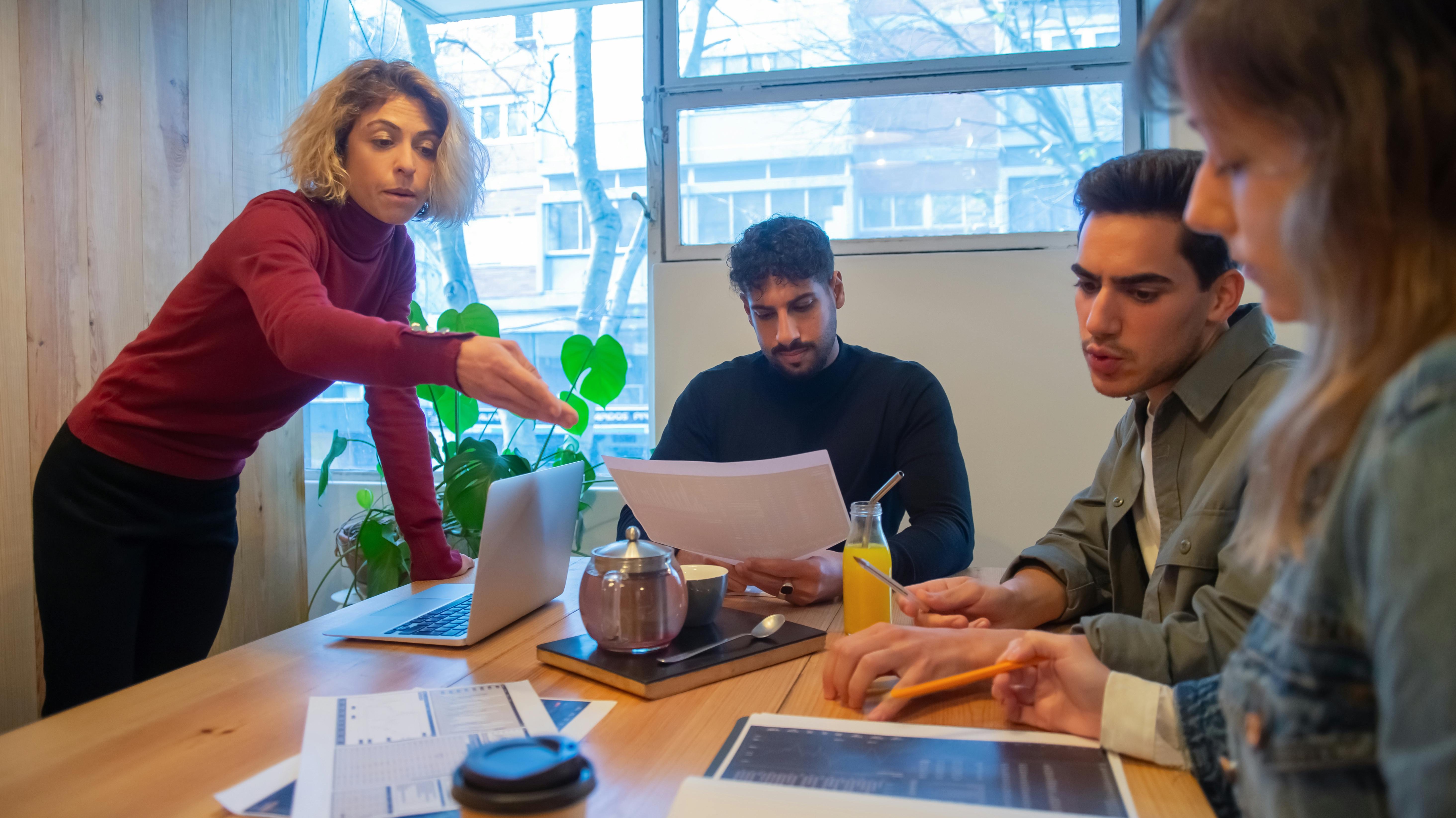 Digital HR technology magnifying glass highlighting profiles.