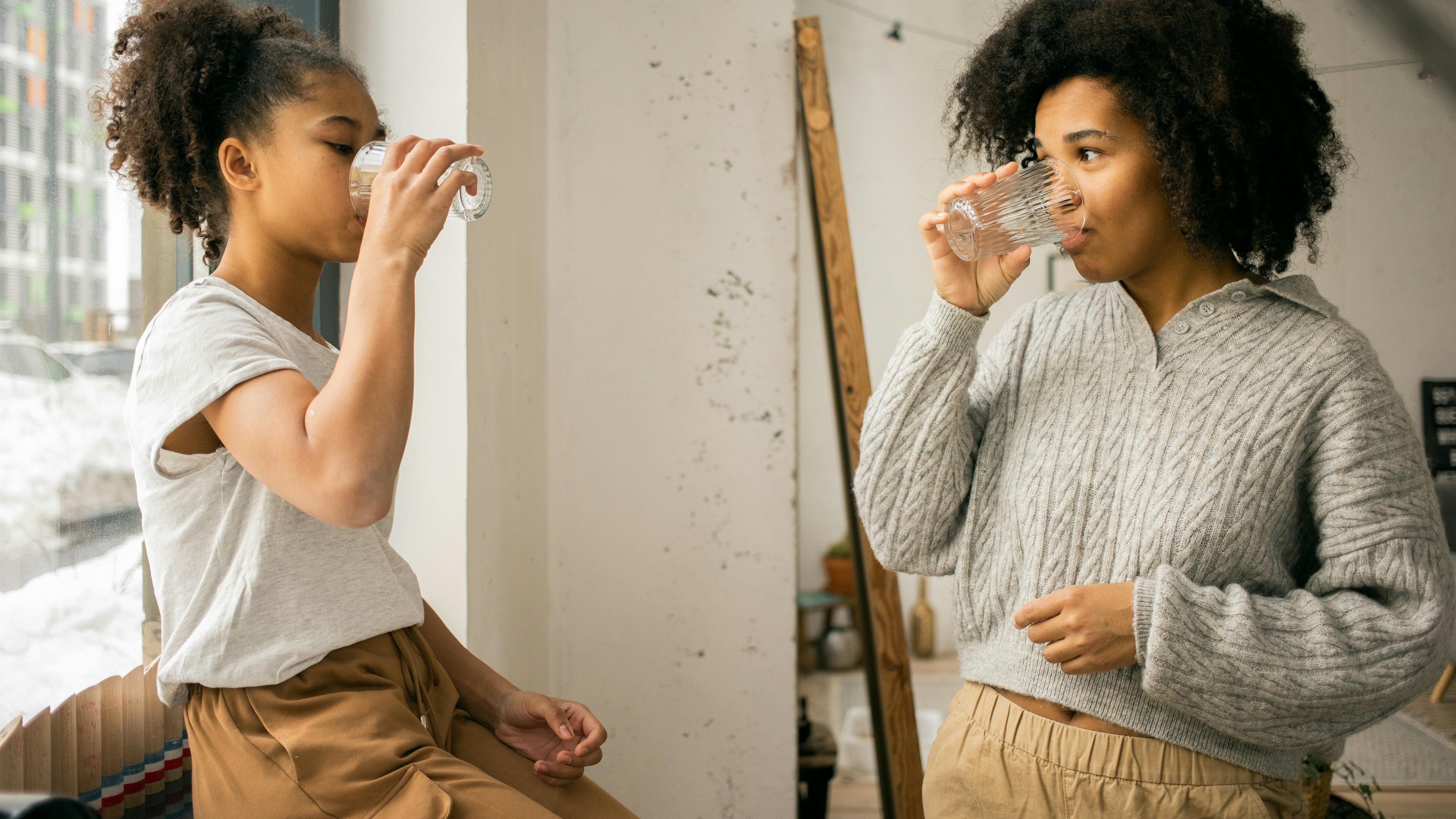 Teenage communication in a happy family setting, enjoying and conversing.
