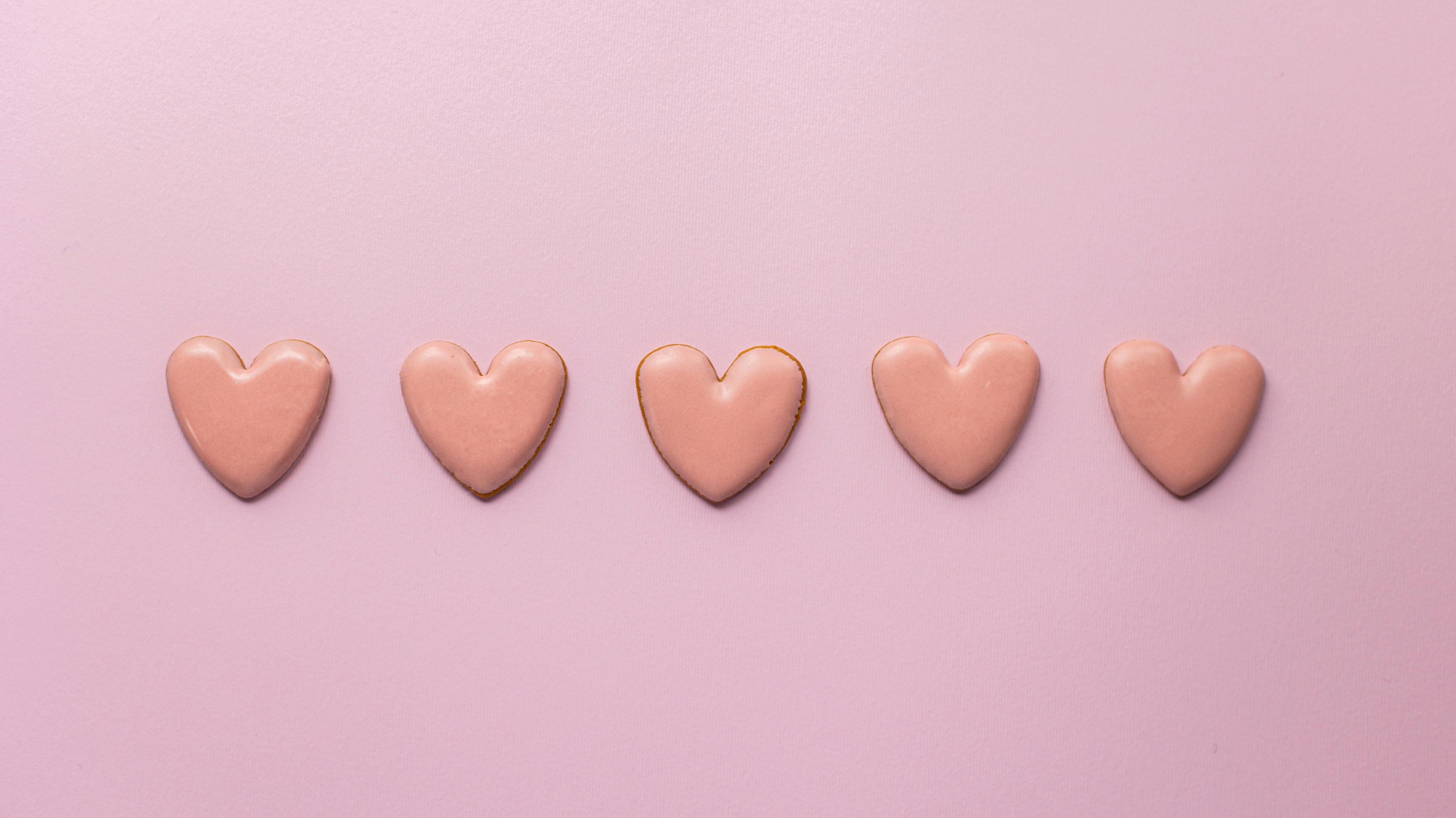 Galentine’s Sip & Shop Omaha themed vibrant red hearts on pink background.