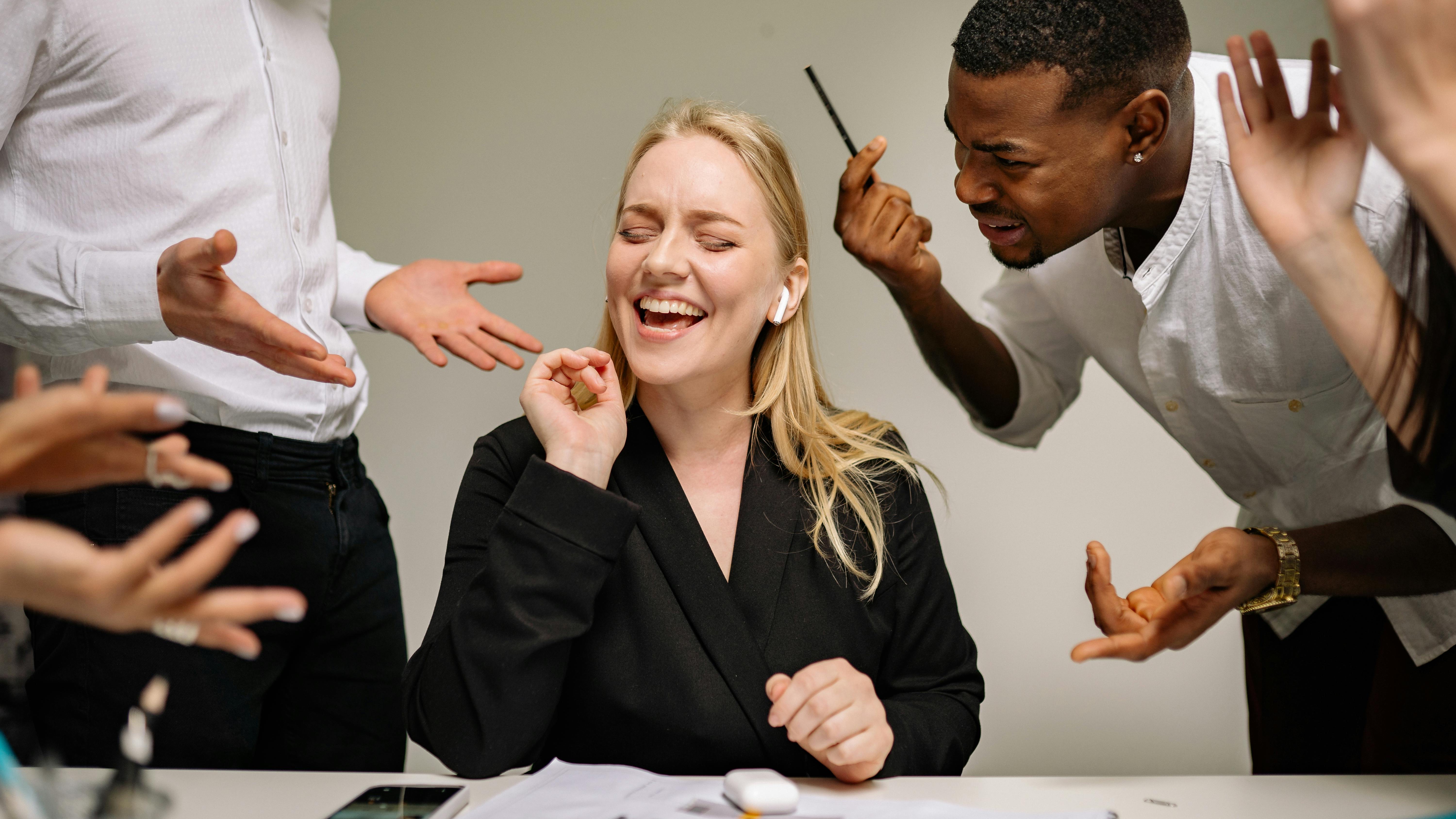 Benefits of storytelling in leadership displayed as professionals discuss in meeting.
