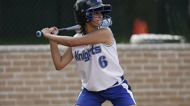 Teen athlete in football gear sprinting on the field, EKGs for Teen Athletes.