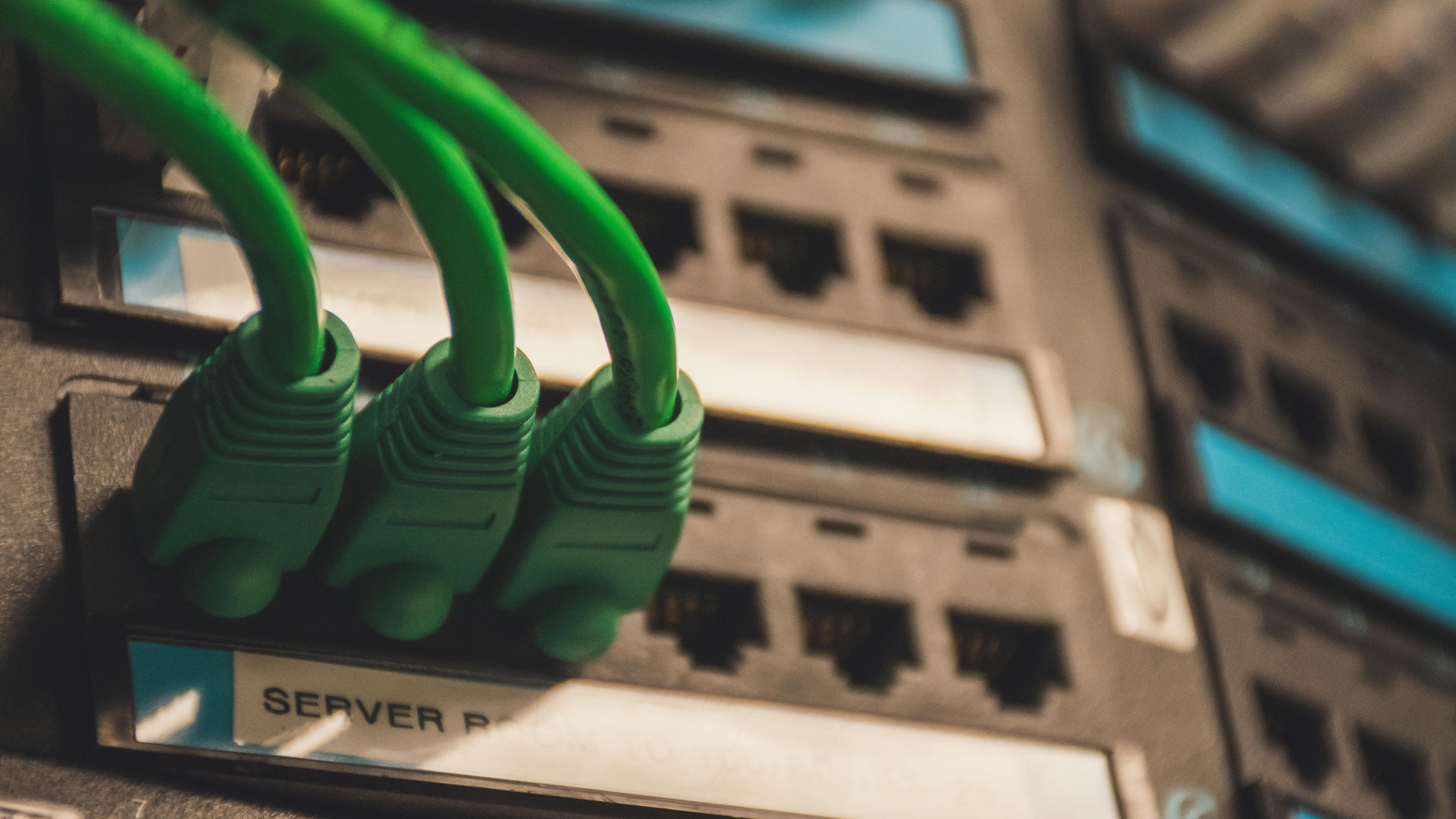 Technician working on fiber optic cabinet for fiber internet expansion in Tiawah.