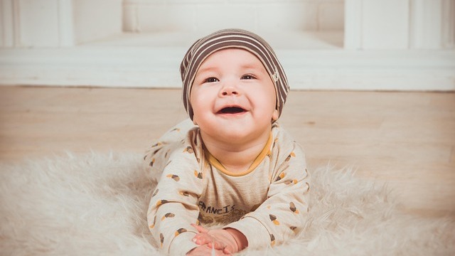 Postpartum self-care with a mother holding a baby.