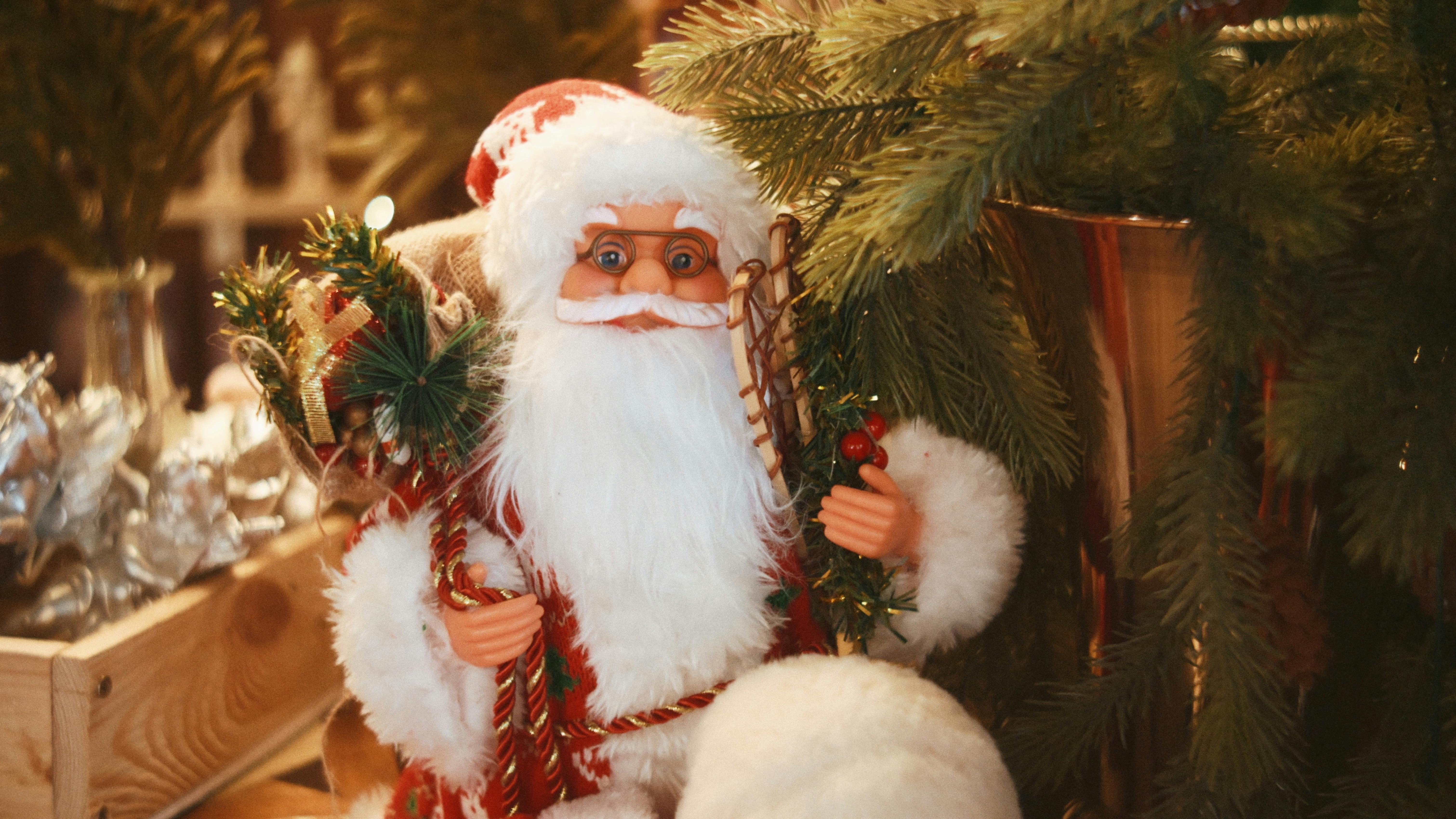 Foraged holiday decor with evergreen foliage over fireplace.