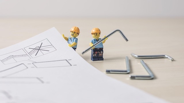 Natural wood DIY buffet table with storage and black vase.