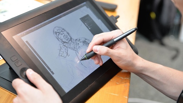 Young woman using AI-powered course creation tools with laptop