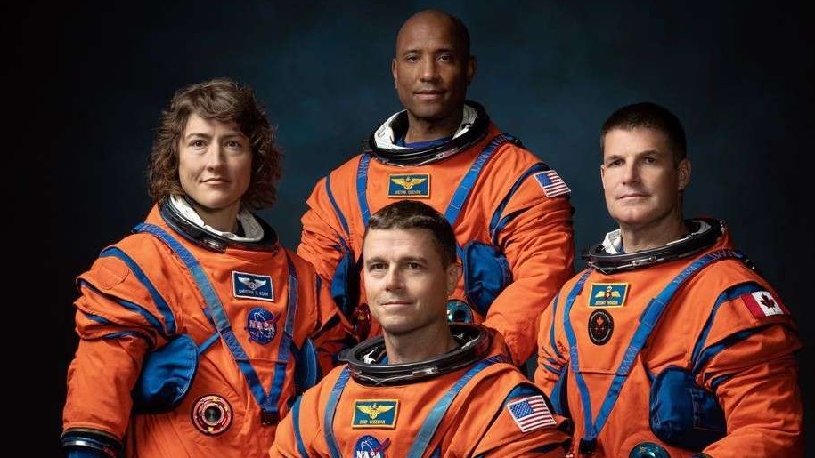 Artemis II crew happily floating inside a spacecraft, 80s sitcom vibe.