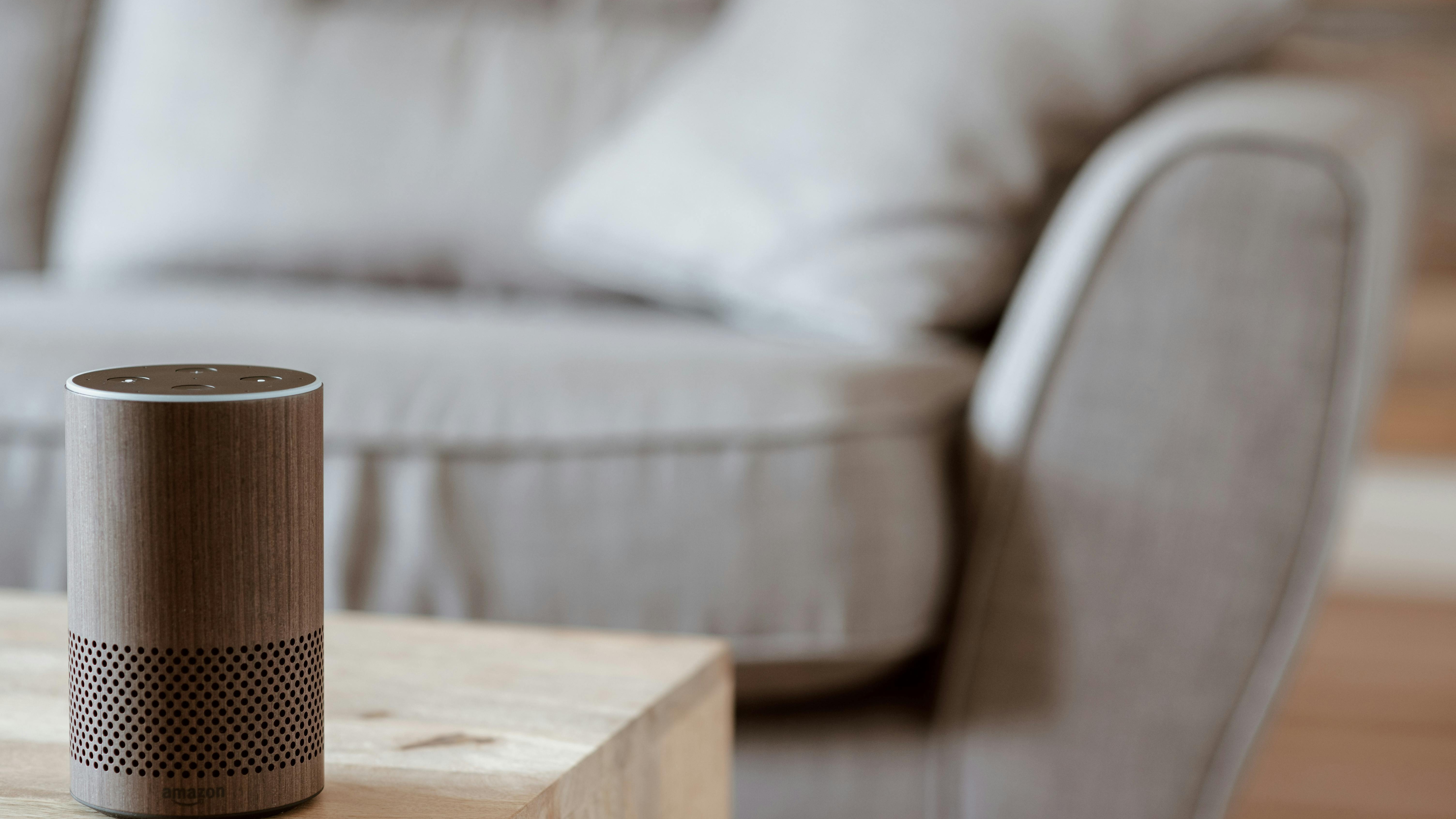 Amazon Echo Spot price drop showcased on vibrant magenta background.