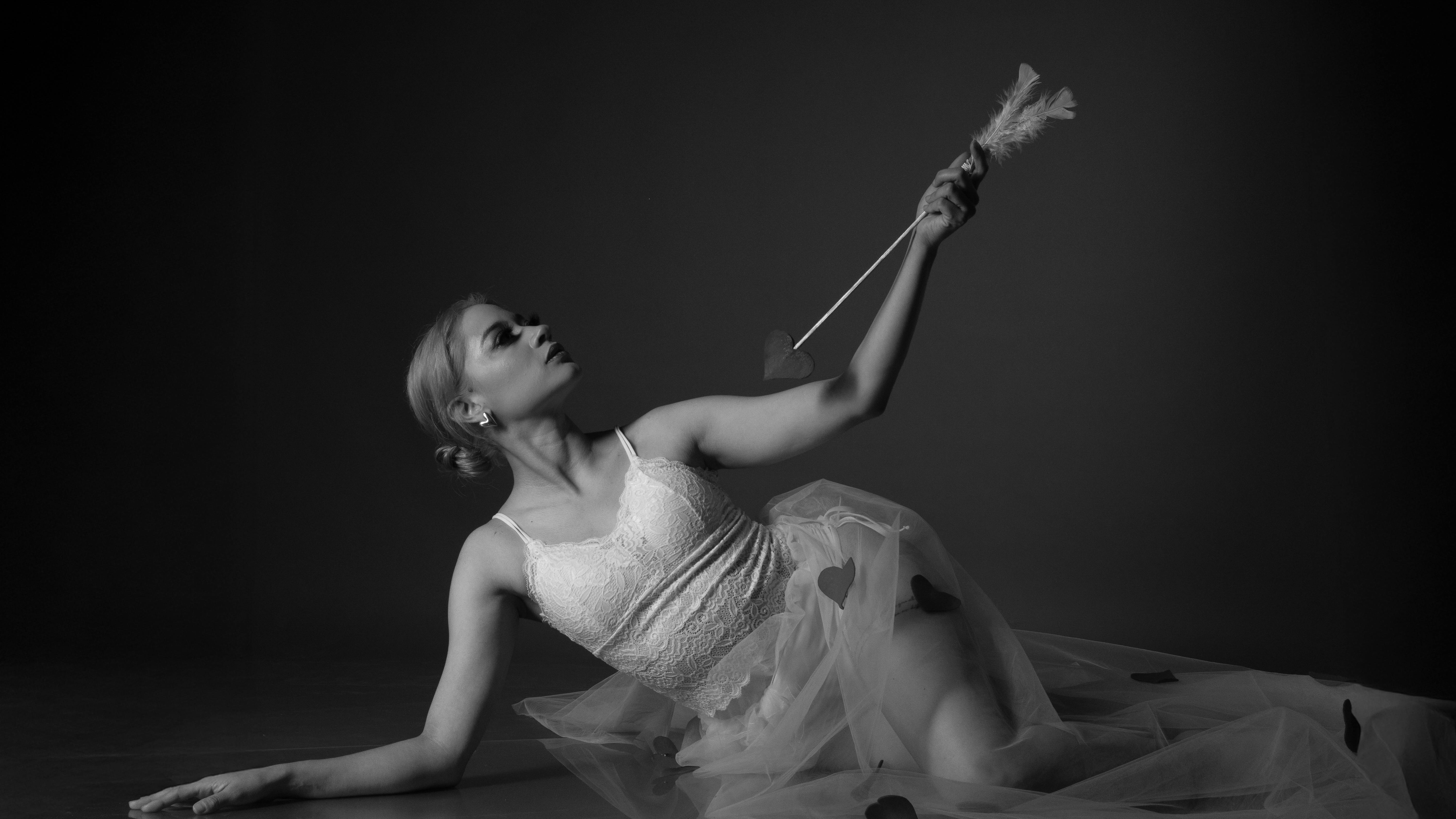 Diverse medieval crowd engrossed in theater, suggesting the emotional impact of Hamnet.