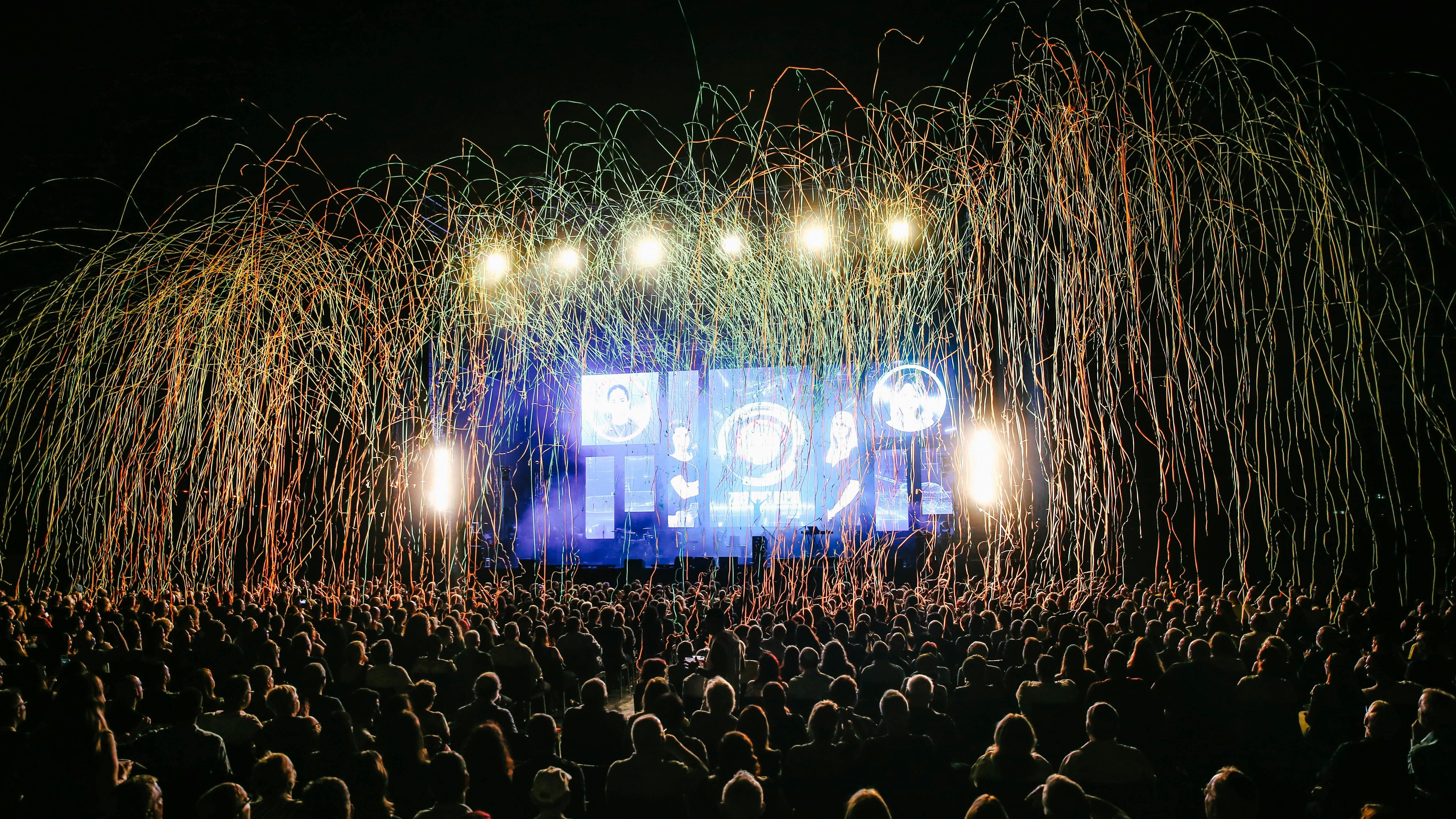 The Growlers concert in Omaha featuring an energetic stage performance with colorful lighting.