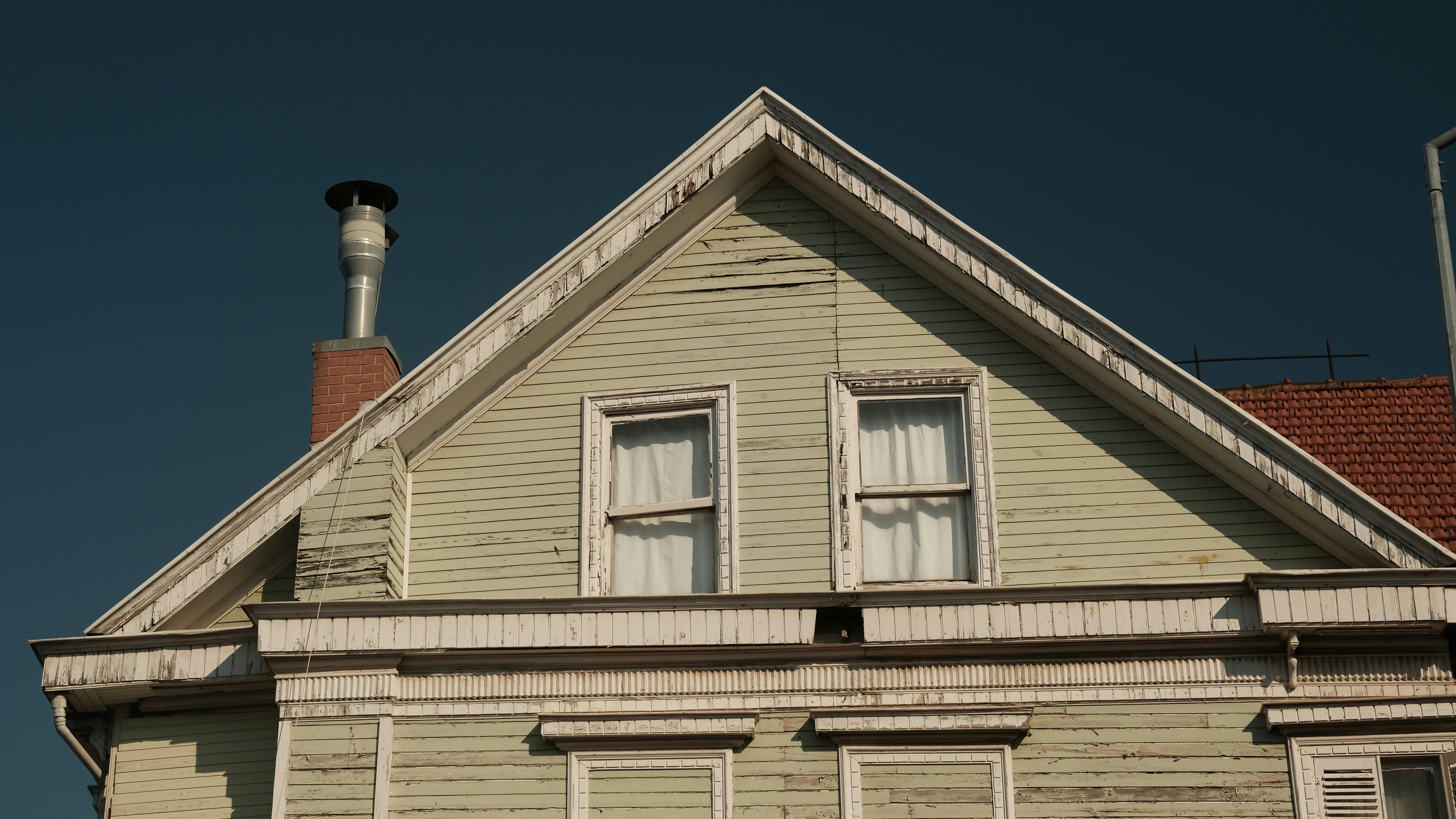 Charming older Omaha home with selling homes as-is text.