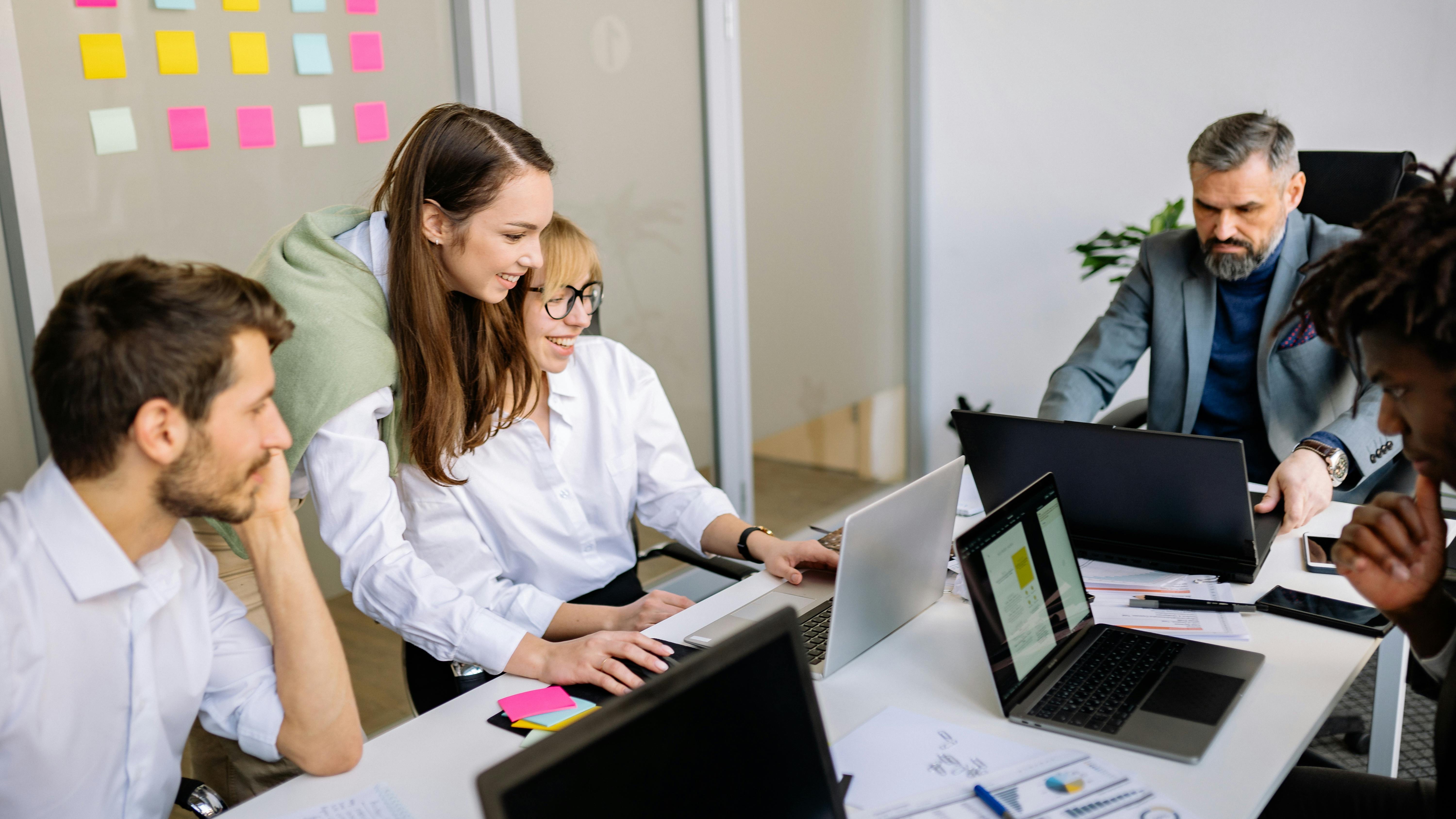 Futuristic depiction of human and digital face interaction, symbolizing HR technology.