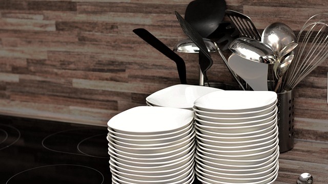 Affordable kitchen storage hacks with organized pots and pans in a rack.