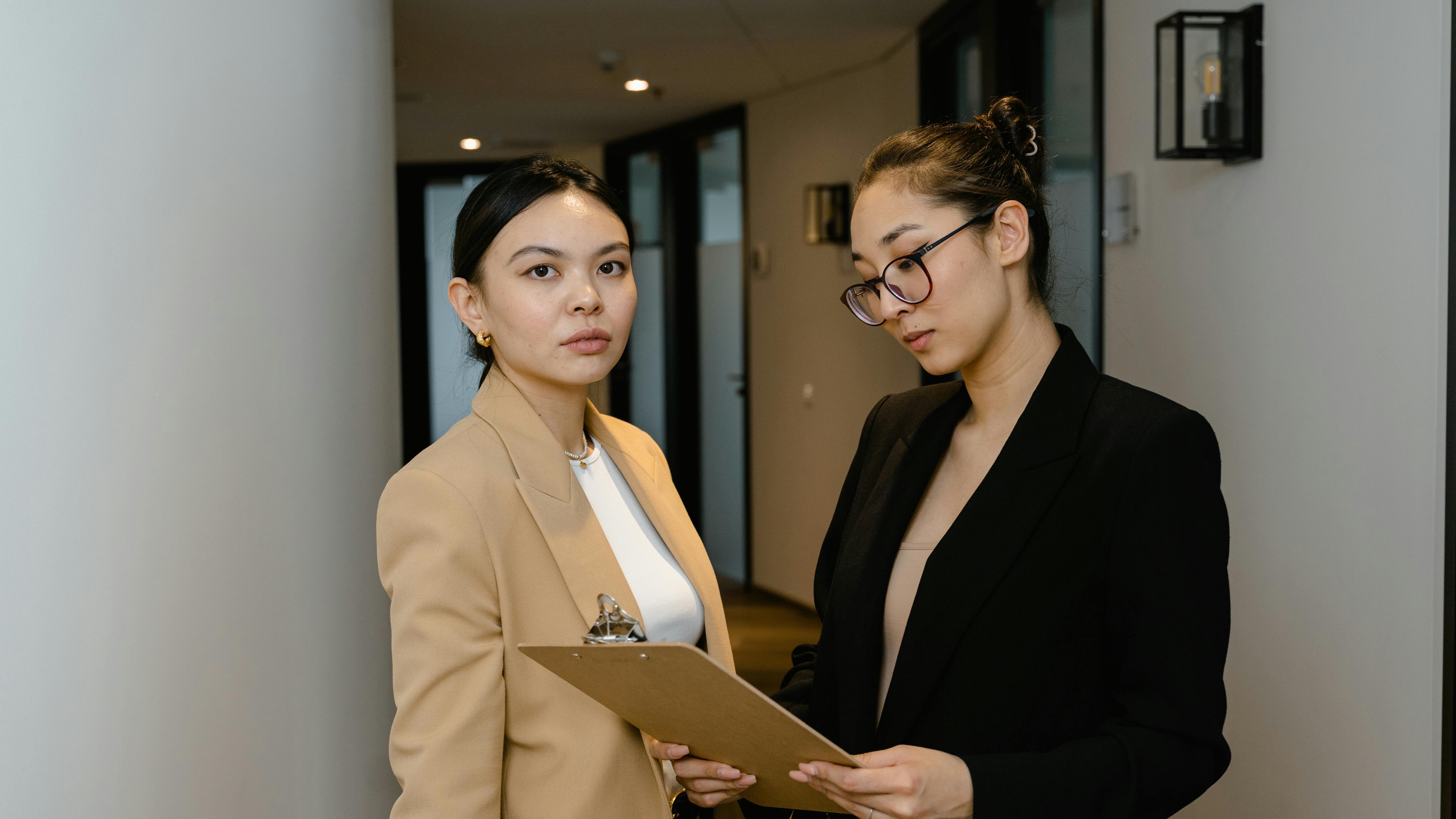 Diverse group laughing in modern office setting, essential business strategy.