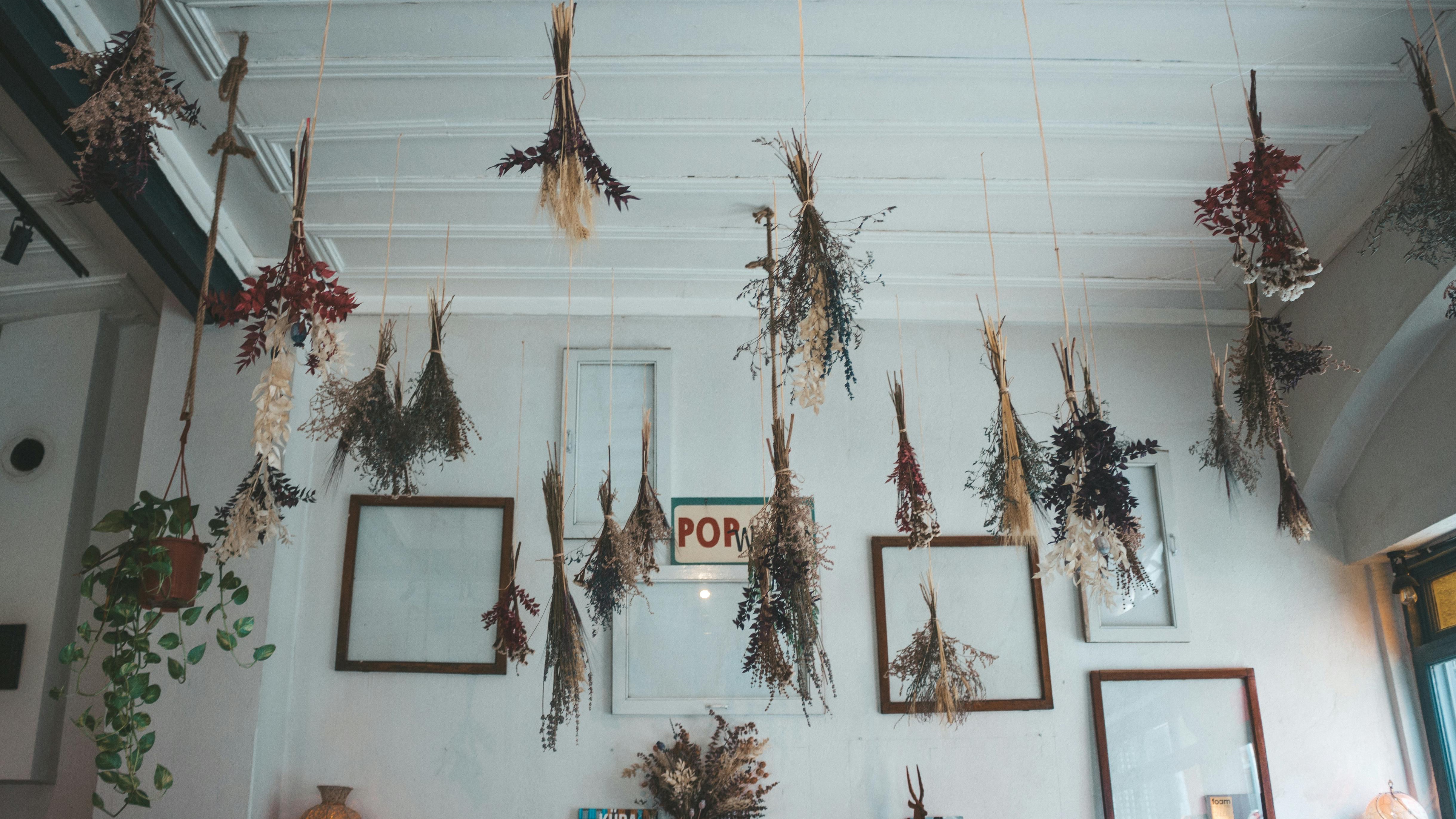 Eclectic home office decor with plant and candles, tacky decor to avoid.