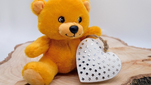 Military member holding Valentine's card, expressing emotion in uniform.