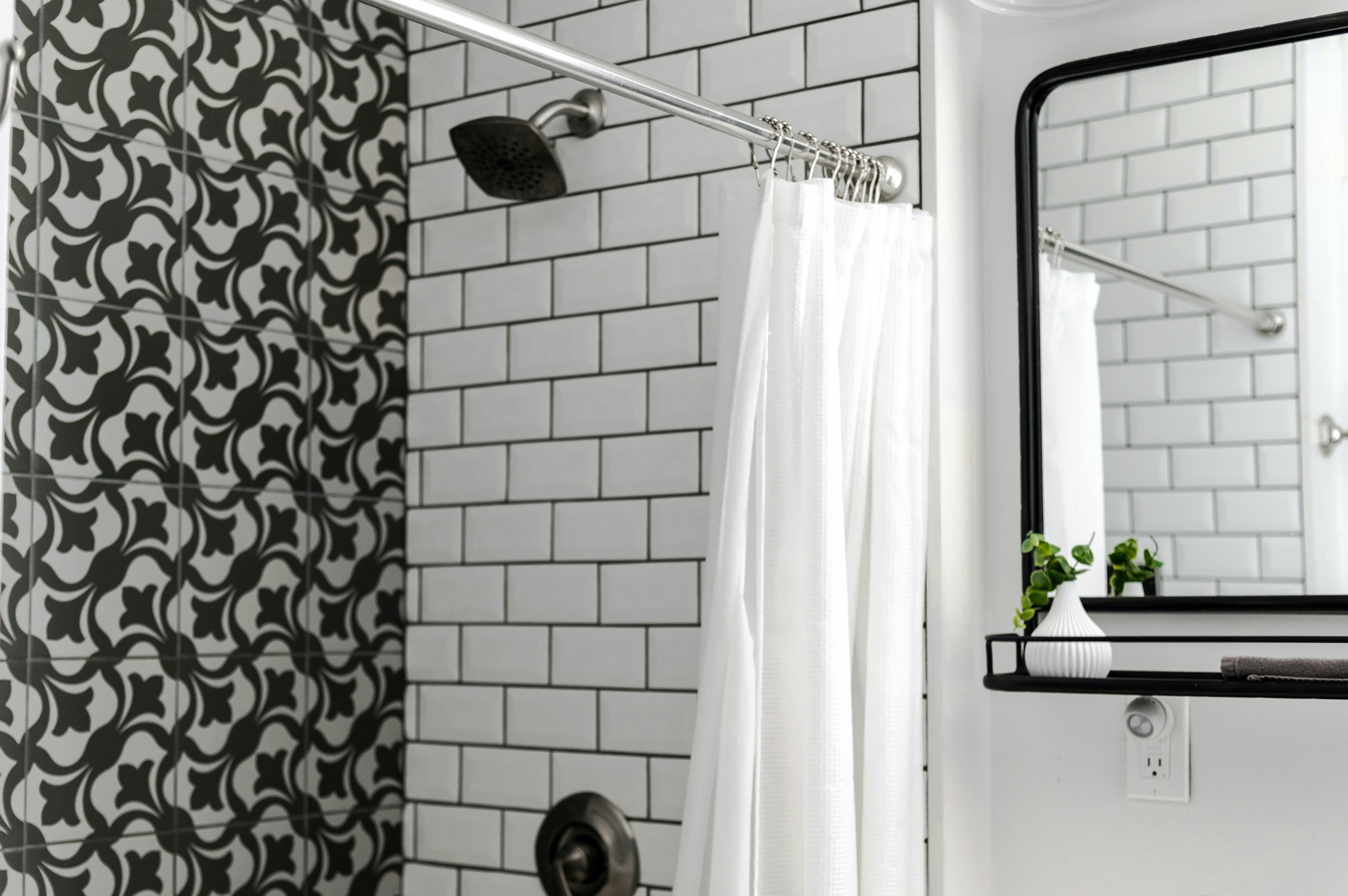 Elegant bathroom with sleek shower curtain upgrade.