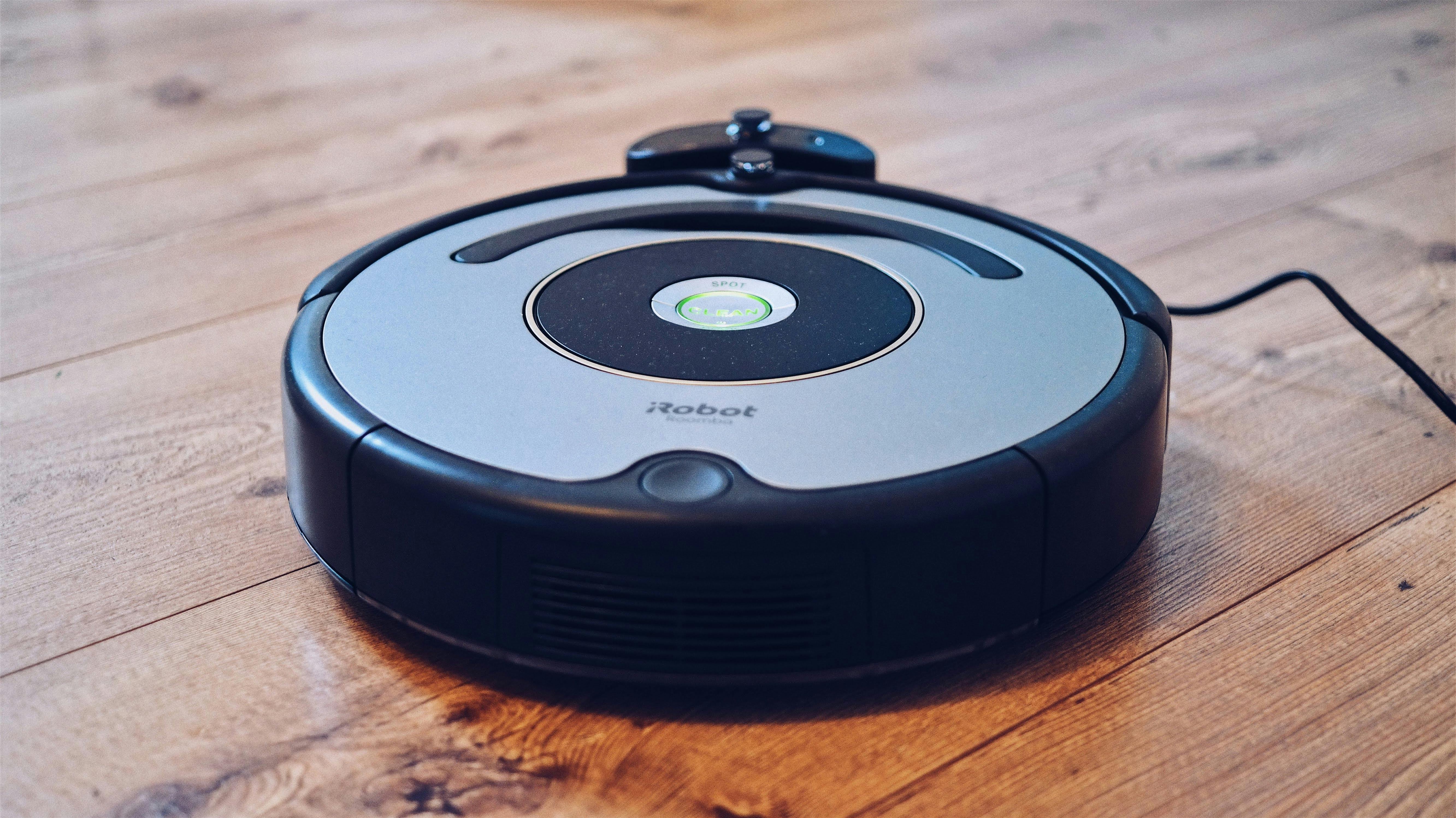Close-up shot of a new robot vacuum setup in a modern home.