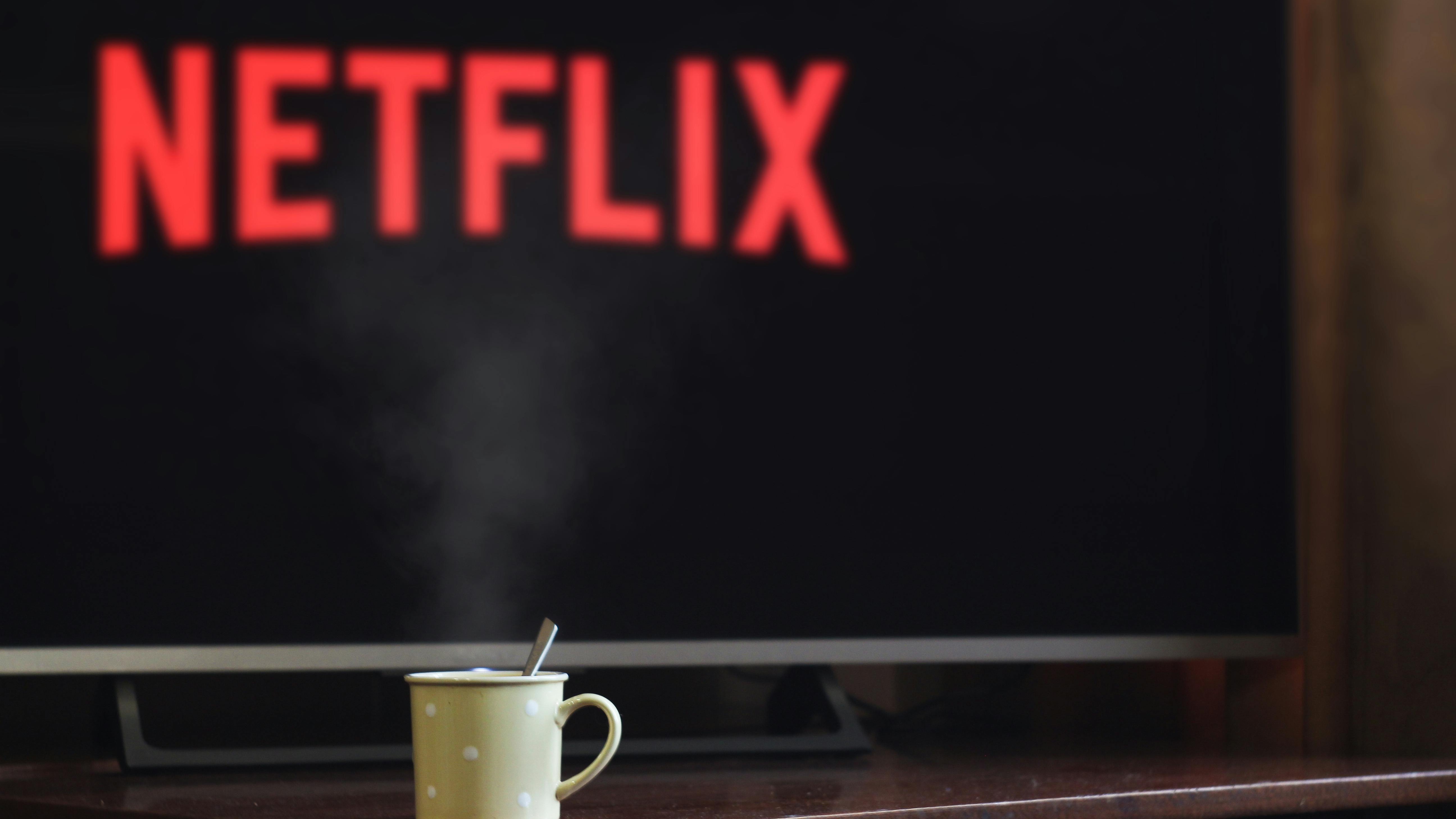 Streaming service logos on screen, internet speeds for streaming focus.