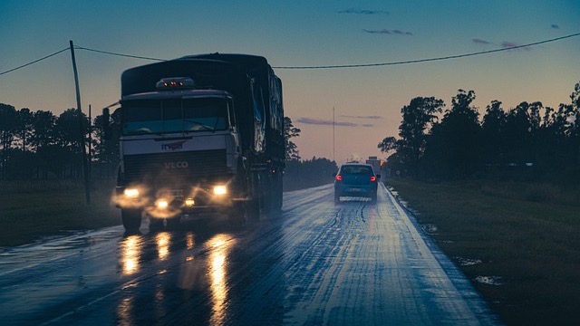 White semi-truck on desert highway illustrating DOL English proficiency rules for foreign truck drivers.