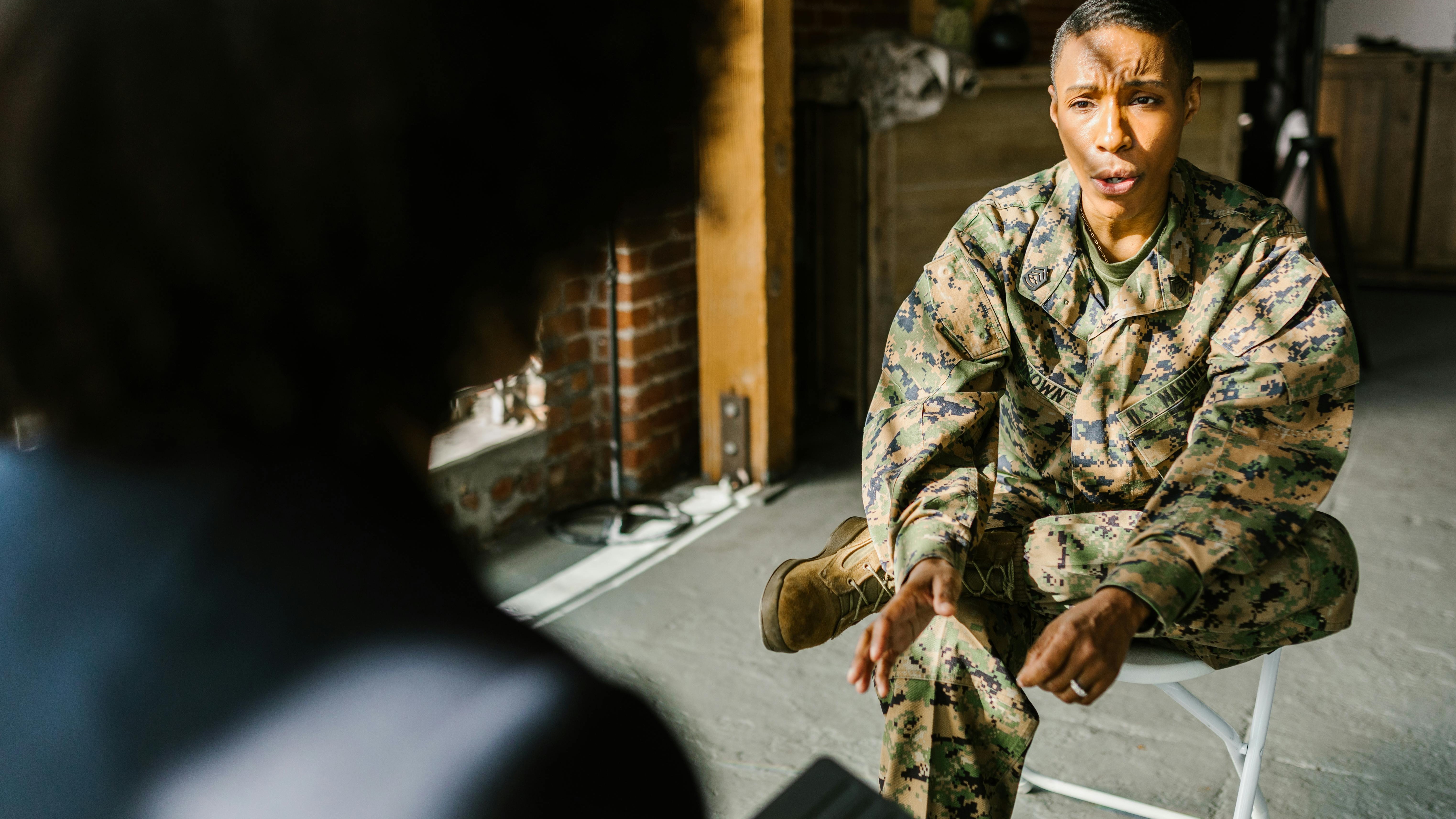 Soldiers collaborating in desert, representing Afghan allies legislative support.