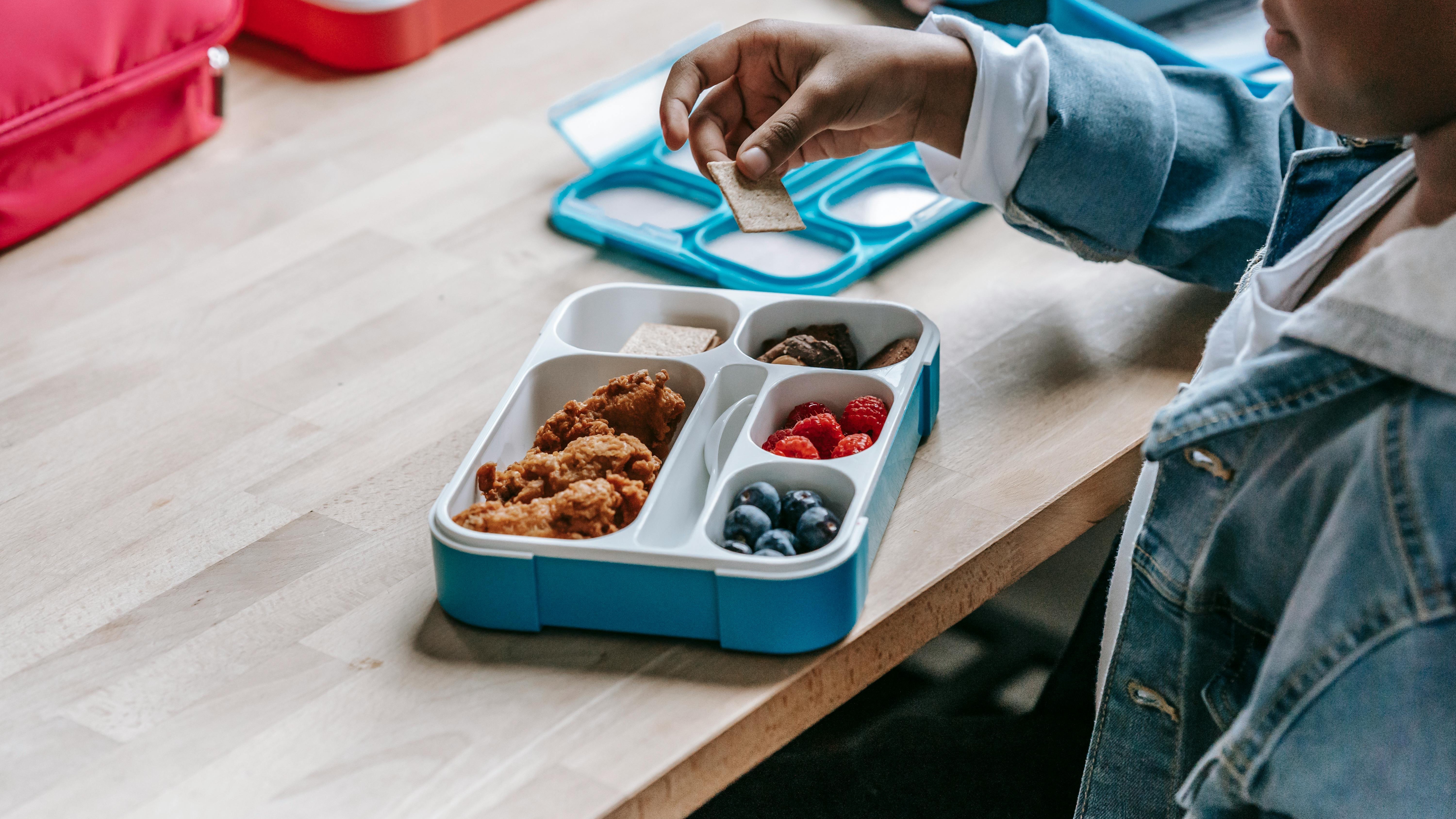 Healthy family meals: Pancakes and fruit in a modern kitchen.