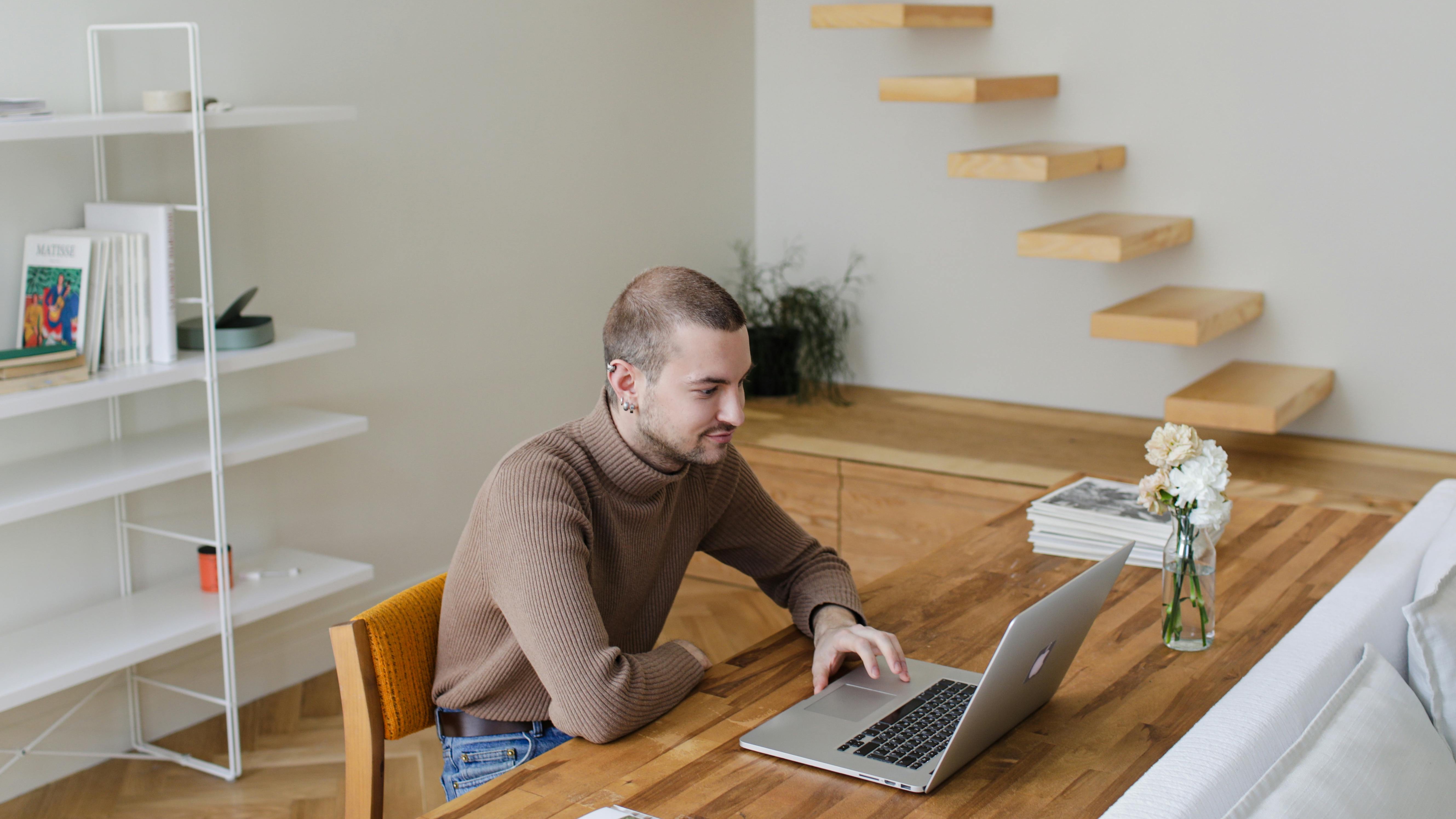 Modern kitchen with sleek cabinetry and bronze fixtures for home office comfort solutions.