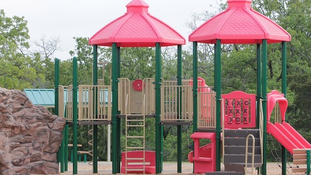 Vibrant inclusive playground in Omaha with colorful equipment.