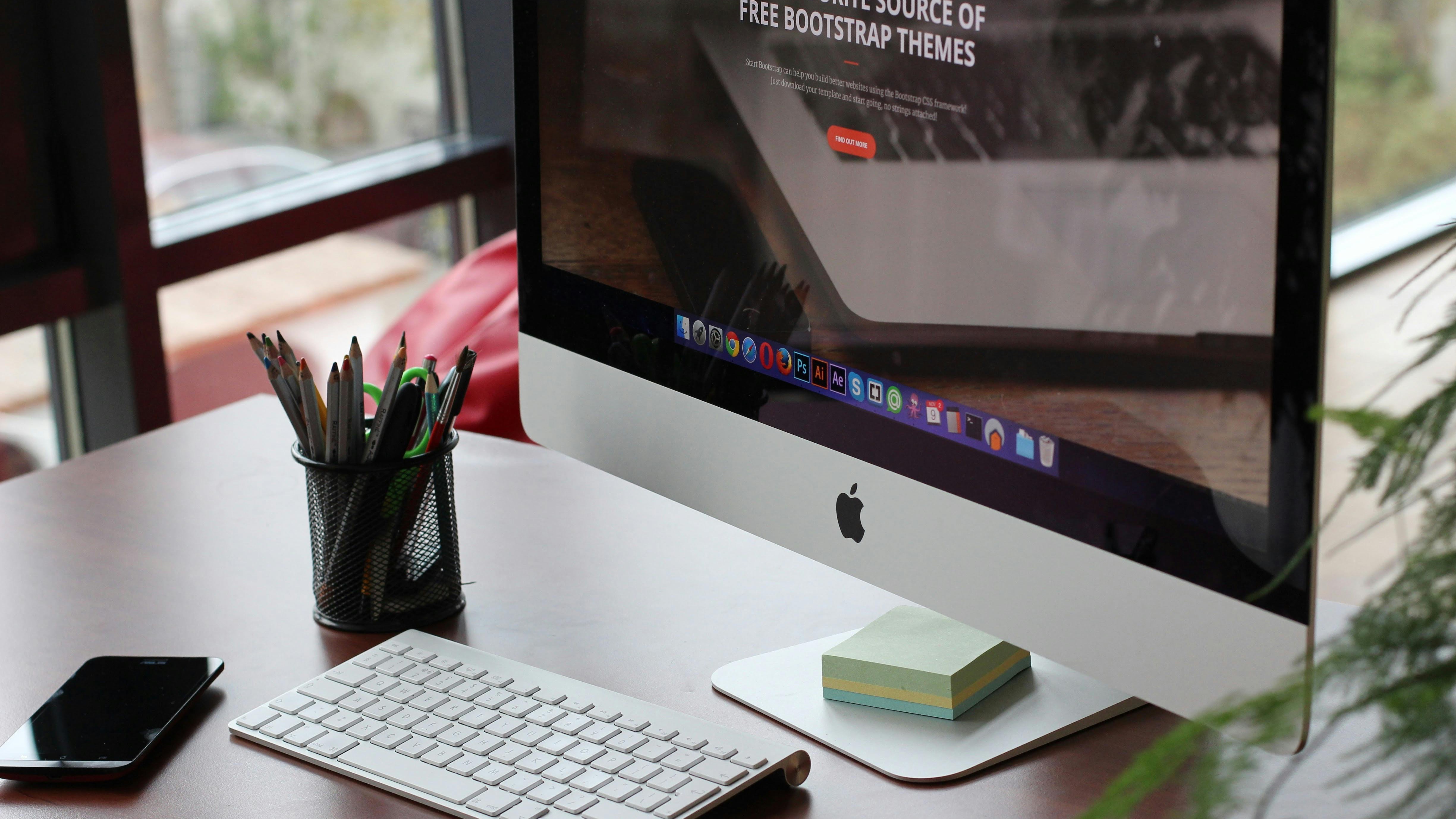 Charming robot holding a sign with snowy mountain village background.
