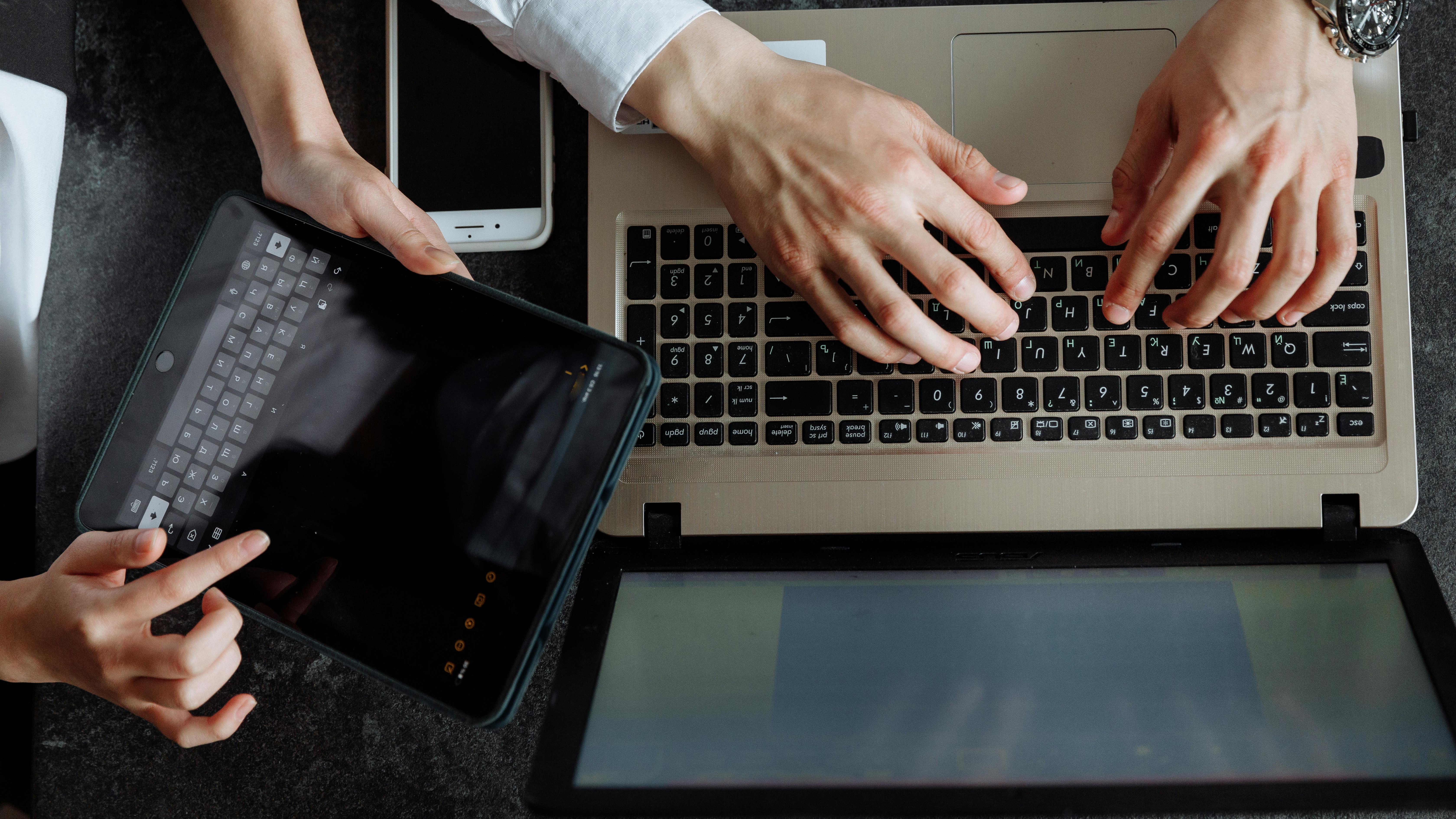 Keyboard key hand sculpture representing Big Tech talent shortage.