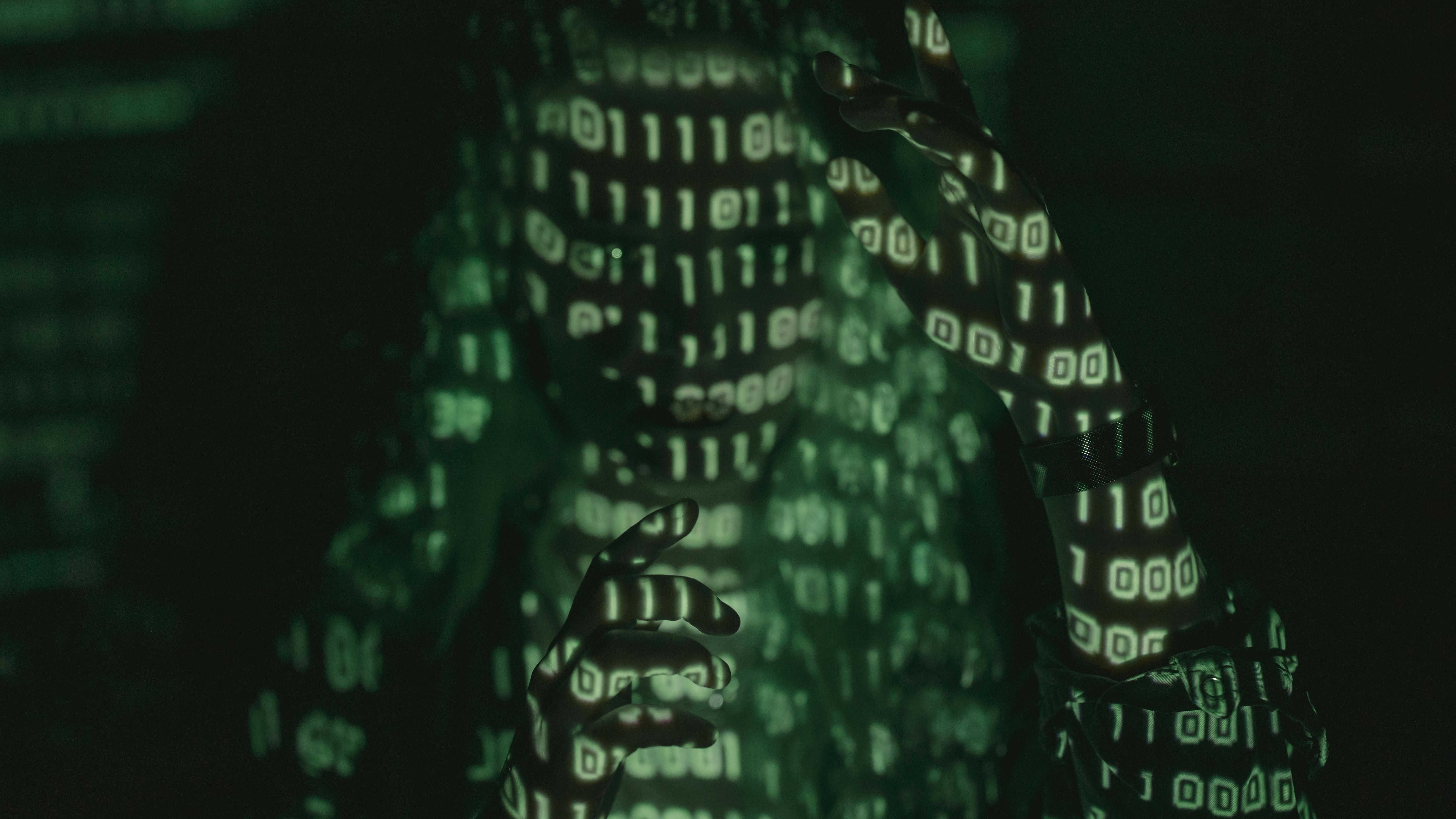 Cybersecurity for remote workers: woman working on laptop at home.