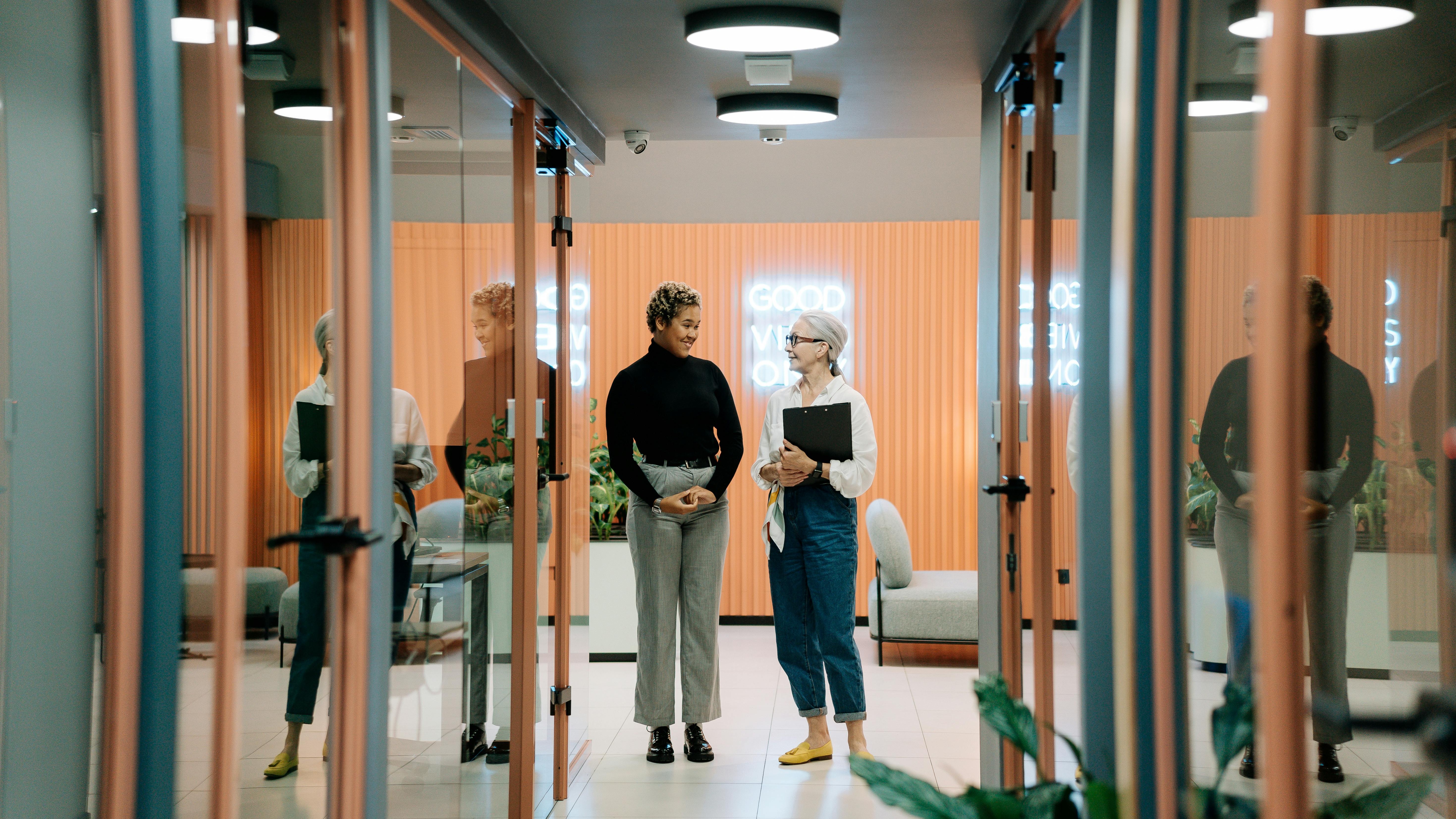 Confident woman in urban setting reflecting on skills-first hiring strategies.