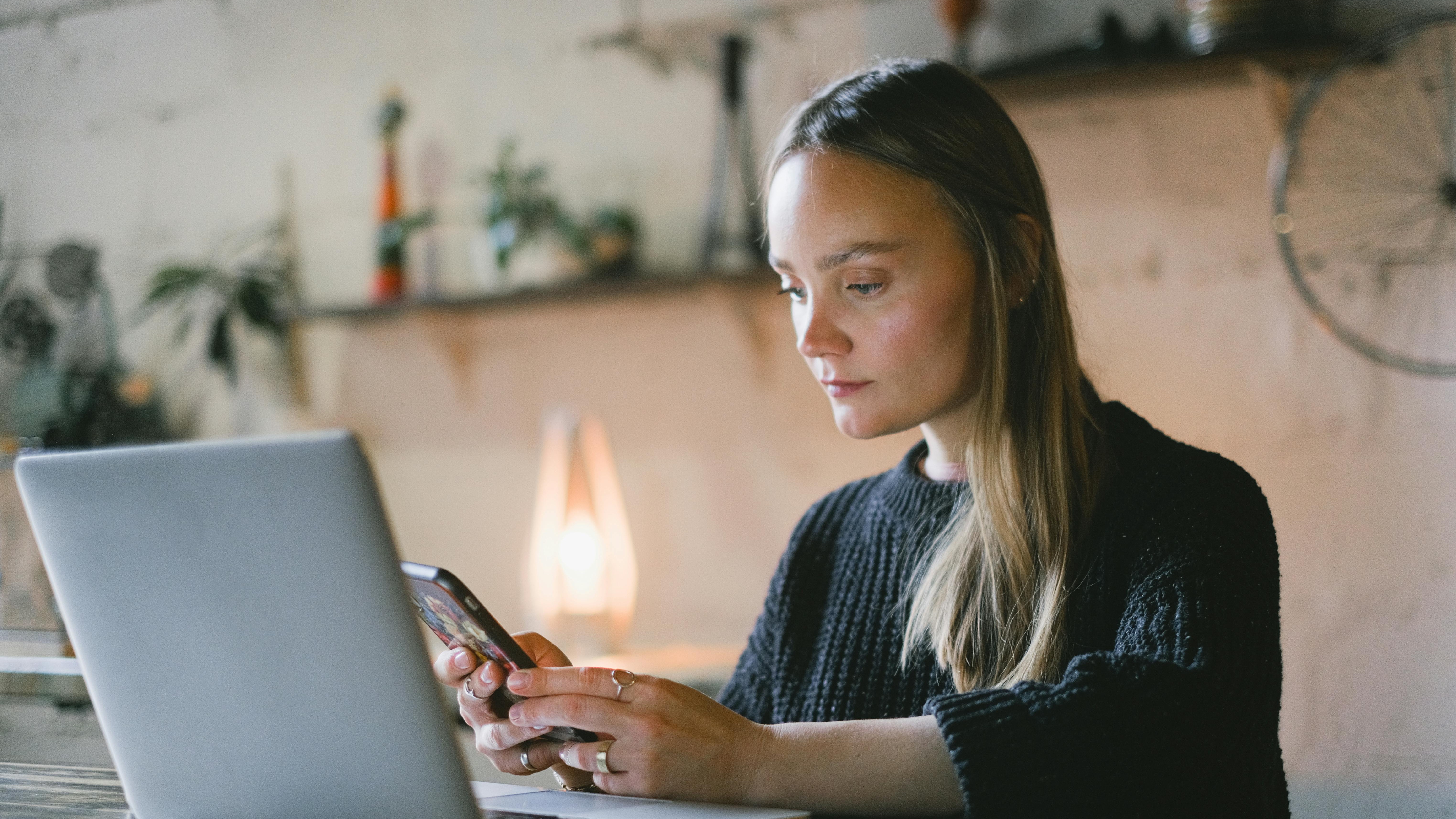 Charming gray home exterior with landscaping for affordable home upgrades.