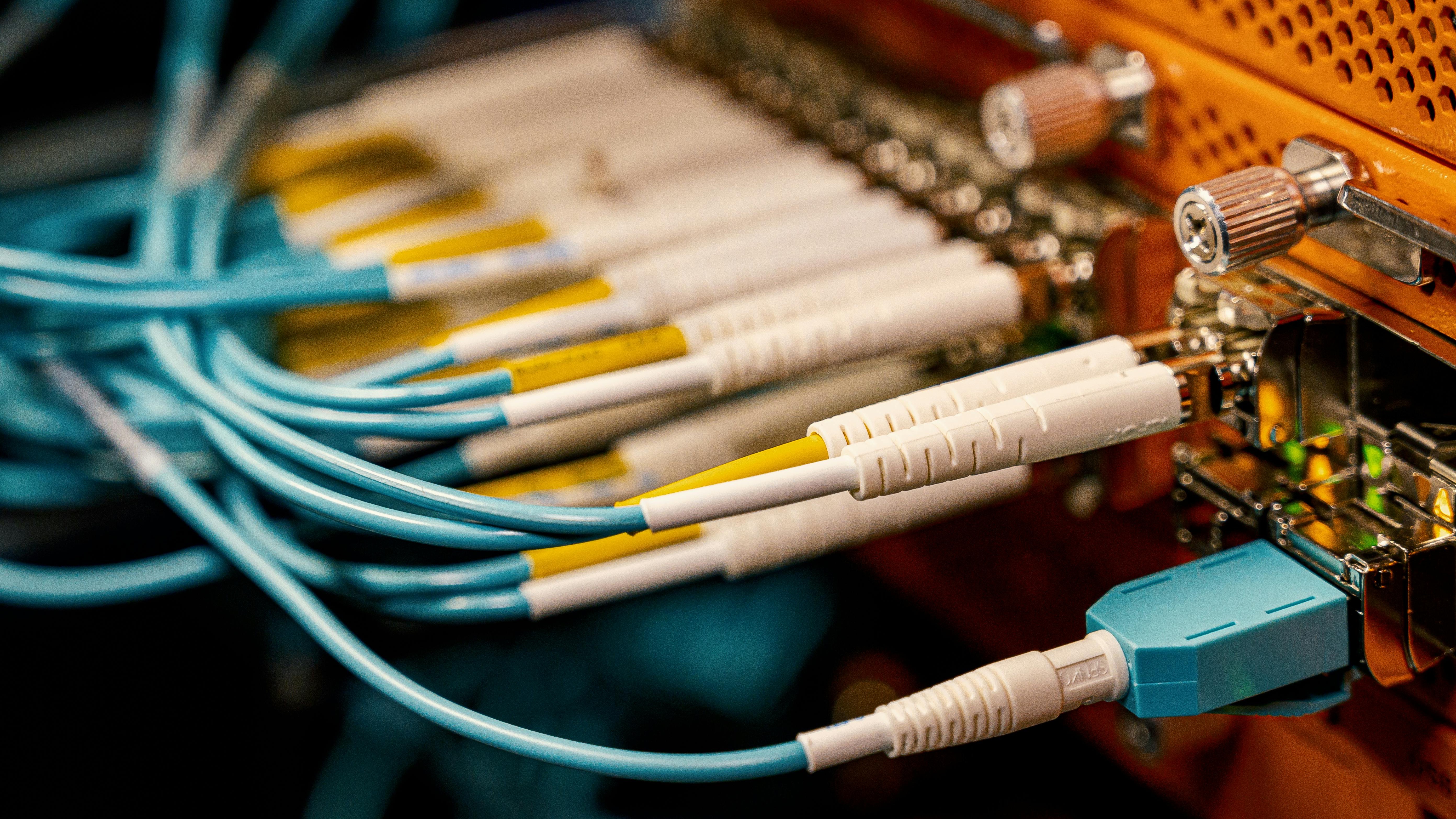 Fiber optic cables in ISP market joint ventures background.