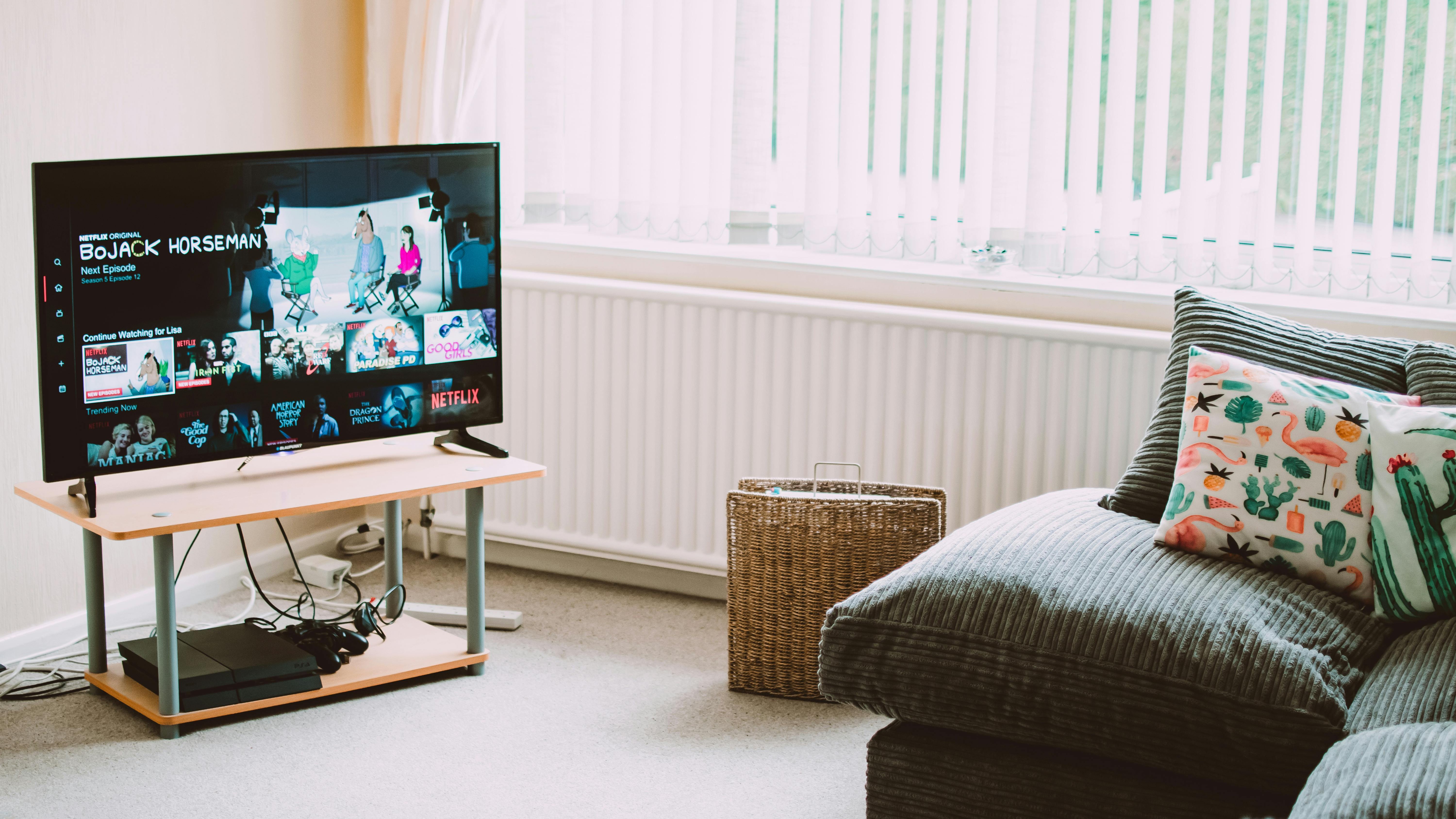 Vibrant IPTV streaming setup with couch and snacks, ideal for live sports and movies.