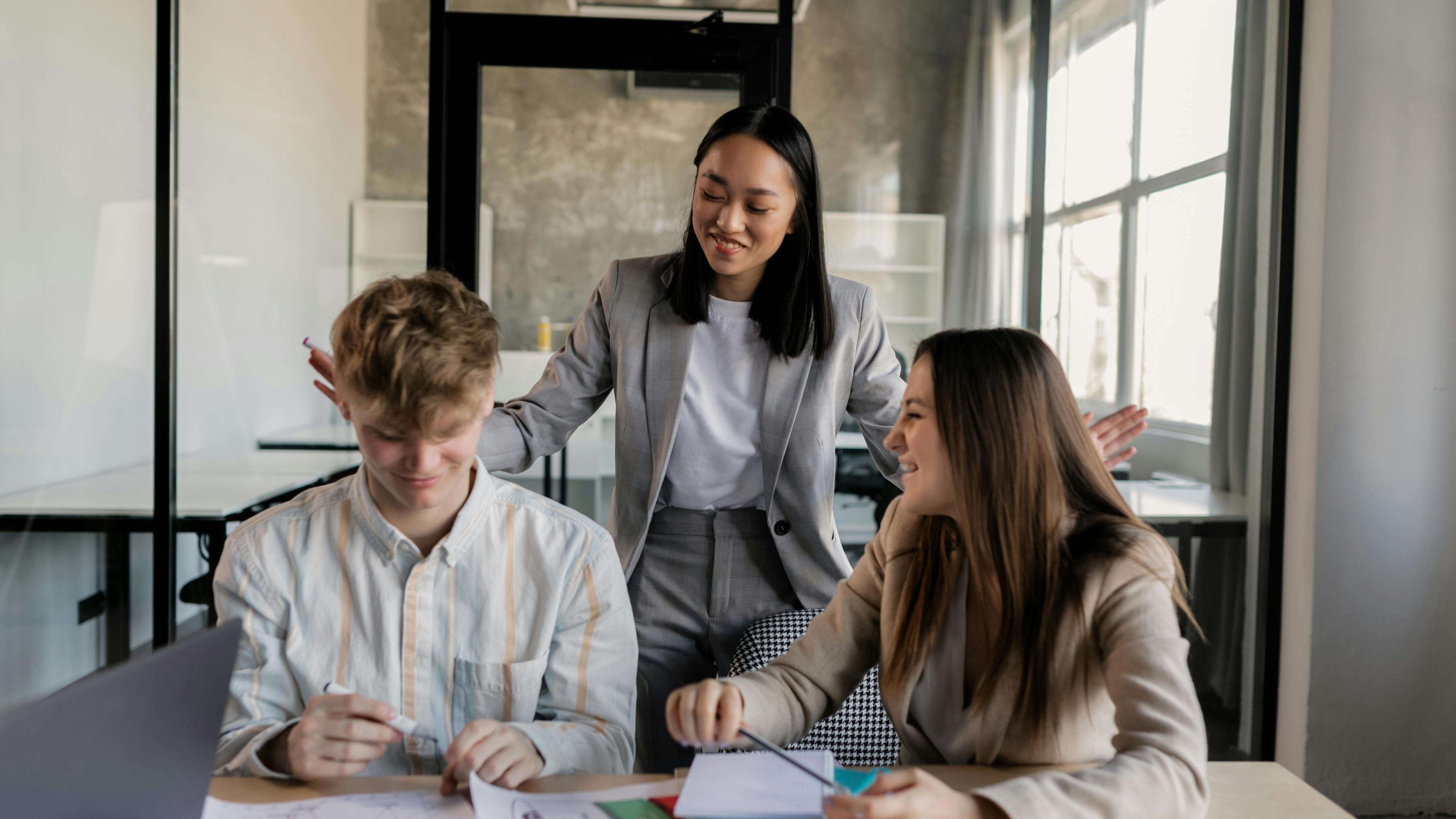 Employee Resource Groups discussing AI transformation in a modern office.