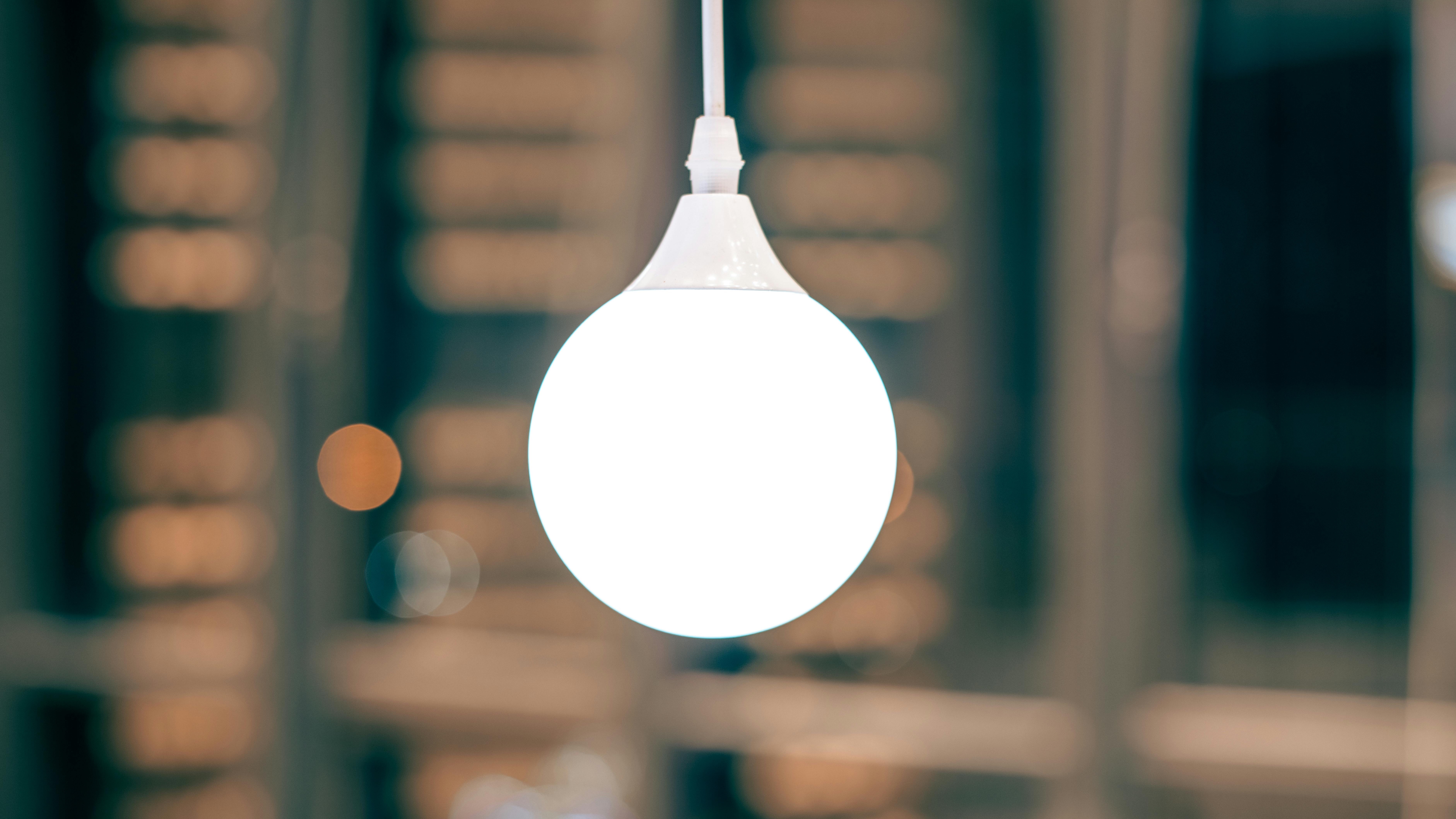 Smart lighting fixture in a kitchen setting illuminating jars.