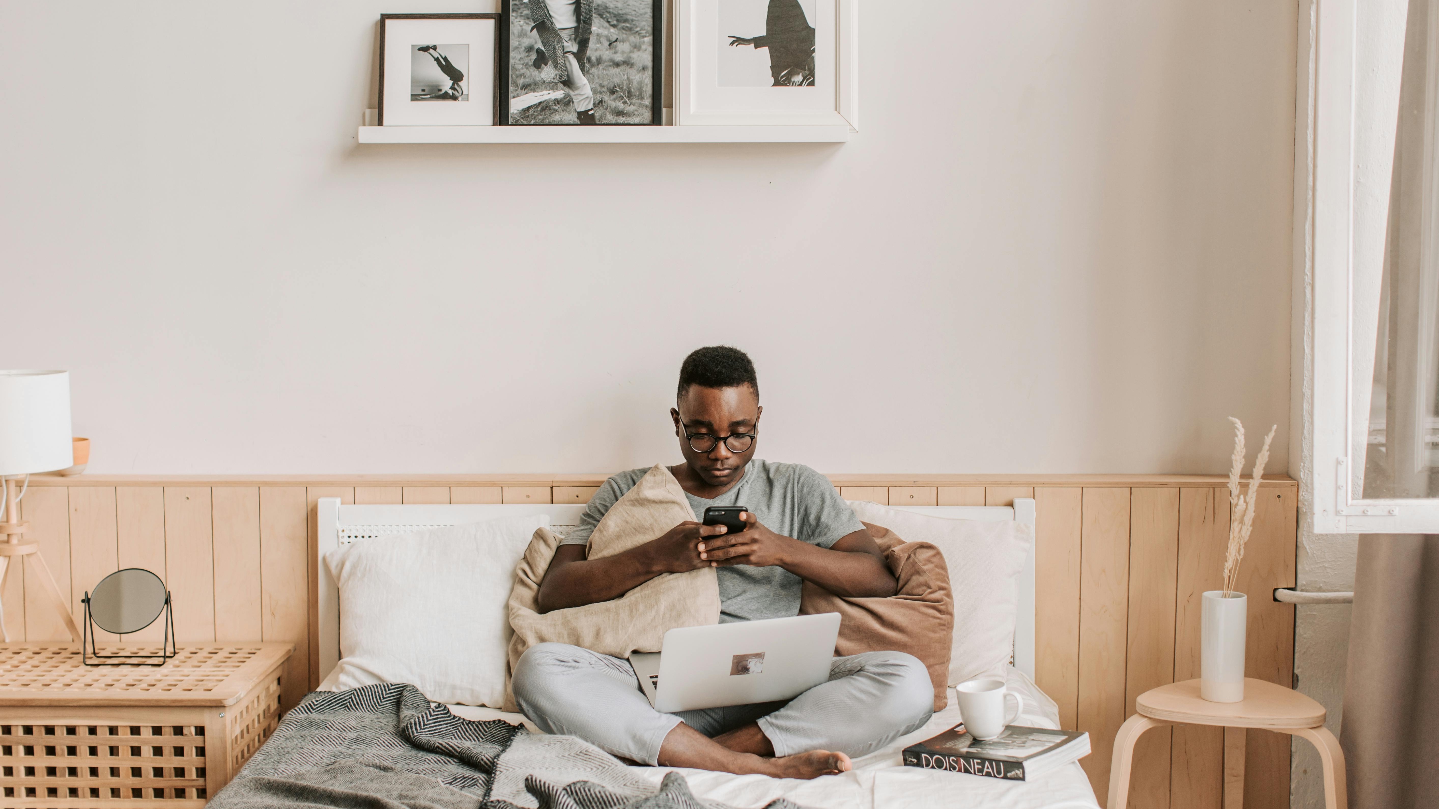 Modern living room design with neutral decor and large windows.