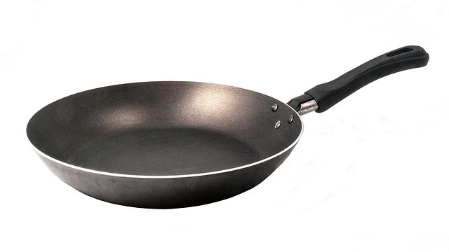 DIY kitchen cabinet pots and pans organizer with open drawer.