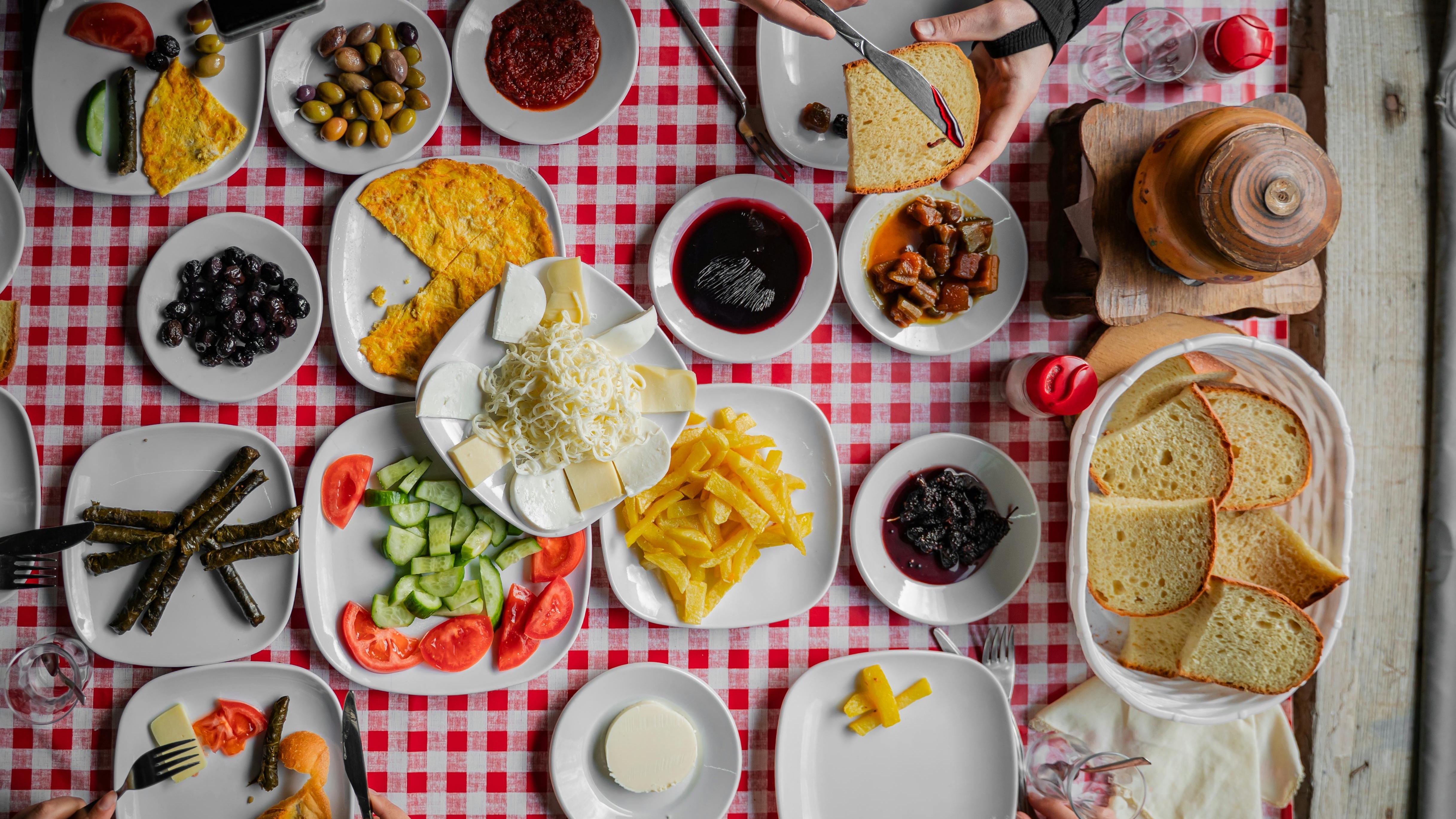 Chef presenting a gourmet dish at culinary events in San Antonio.