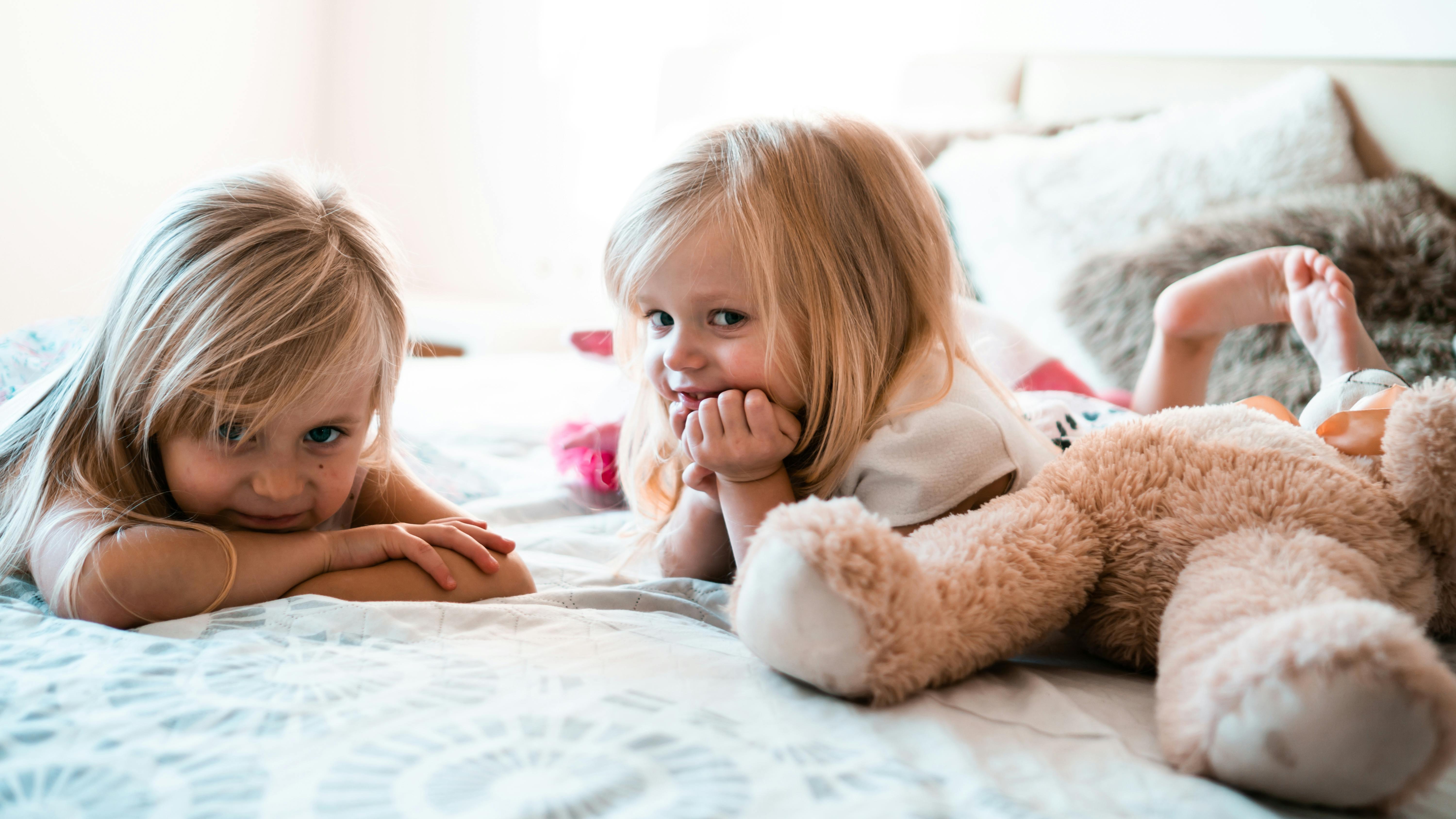 Child sleeping peacefully, showcasing comfort and tranquility on a blue twin mattress.