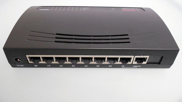 Technician installing fiber optics for high-speed internet services.