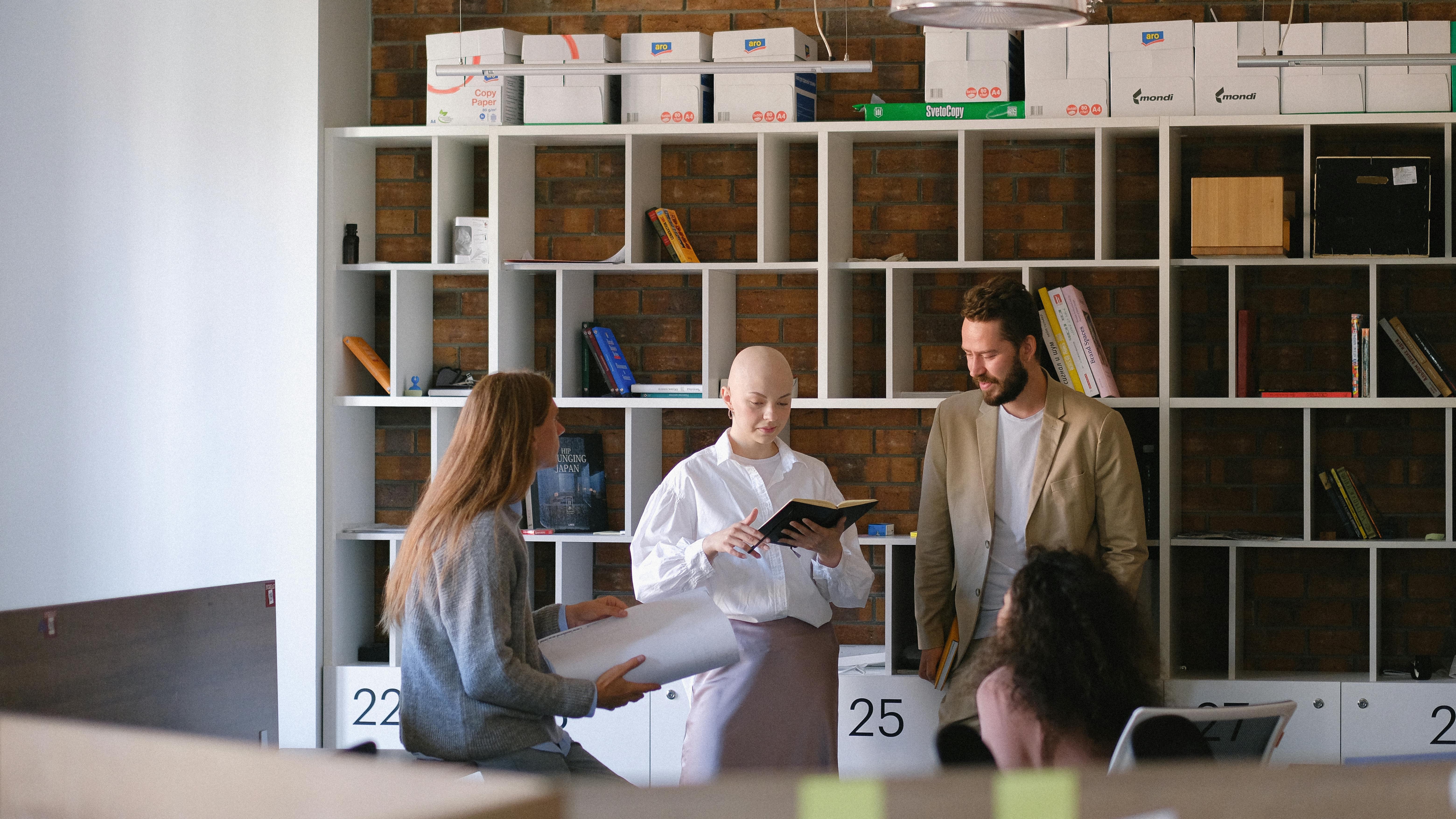 Symbolic split bust, suggesting dual roles in management, against a mustard backdrop.