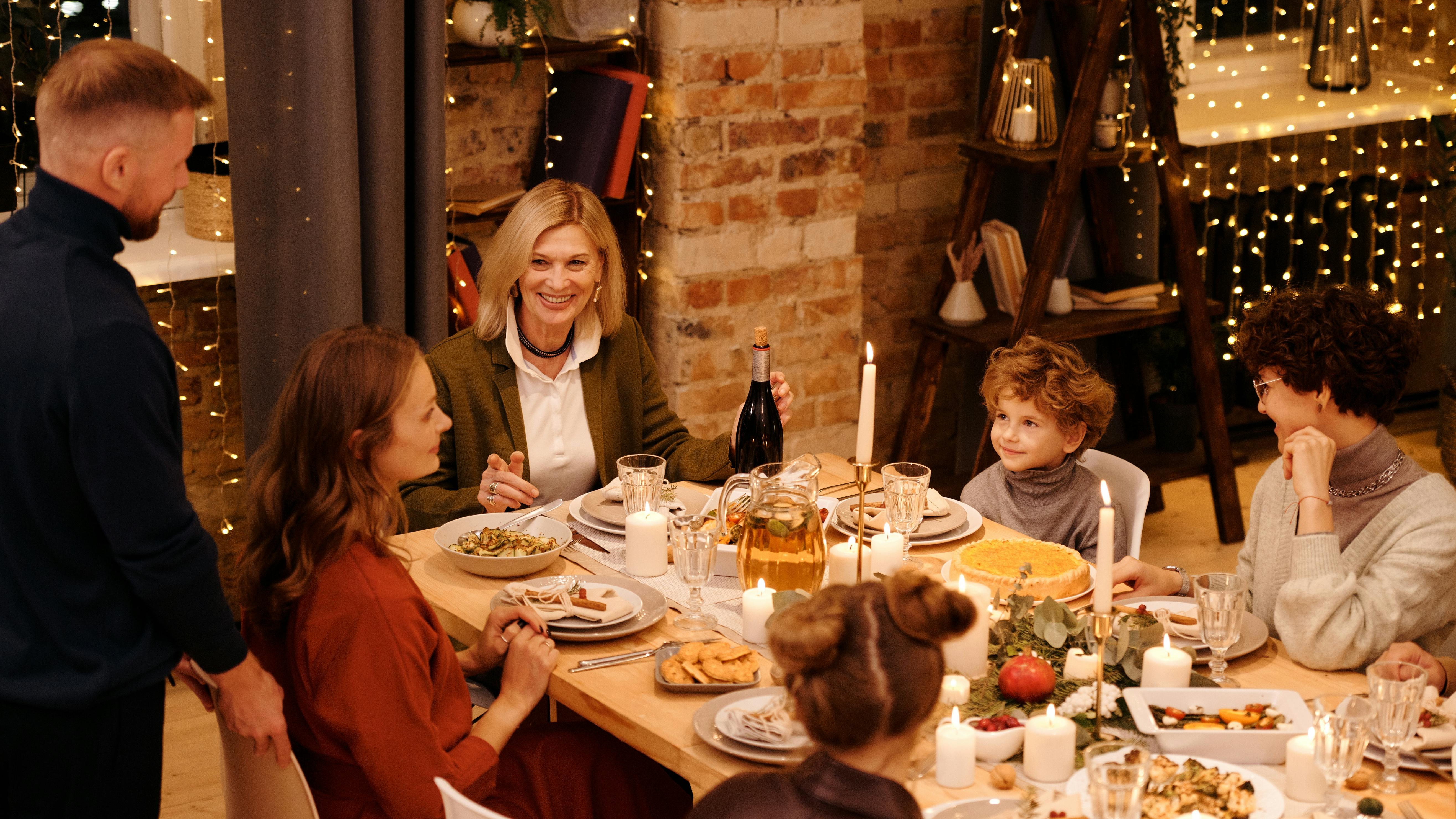 Family practicing co-parenting strategies during holiday gathering