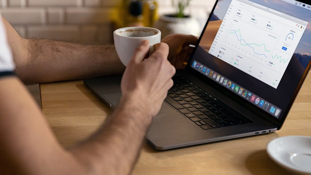 Man on a video call in a relaxed setting, promoting inclusive workplace culture.