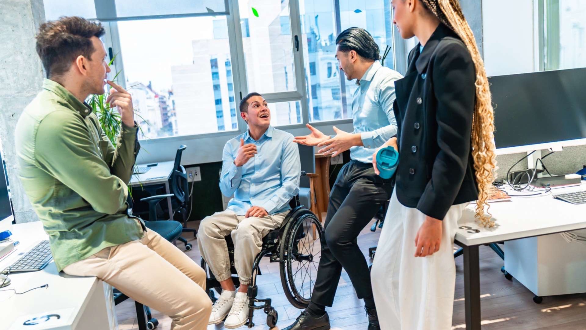 Older woman leading a discussion on business agility and AI adoption in an office.