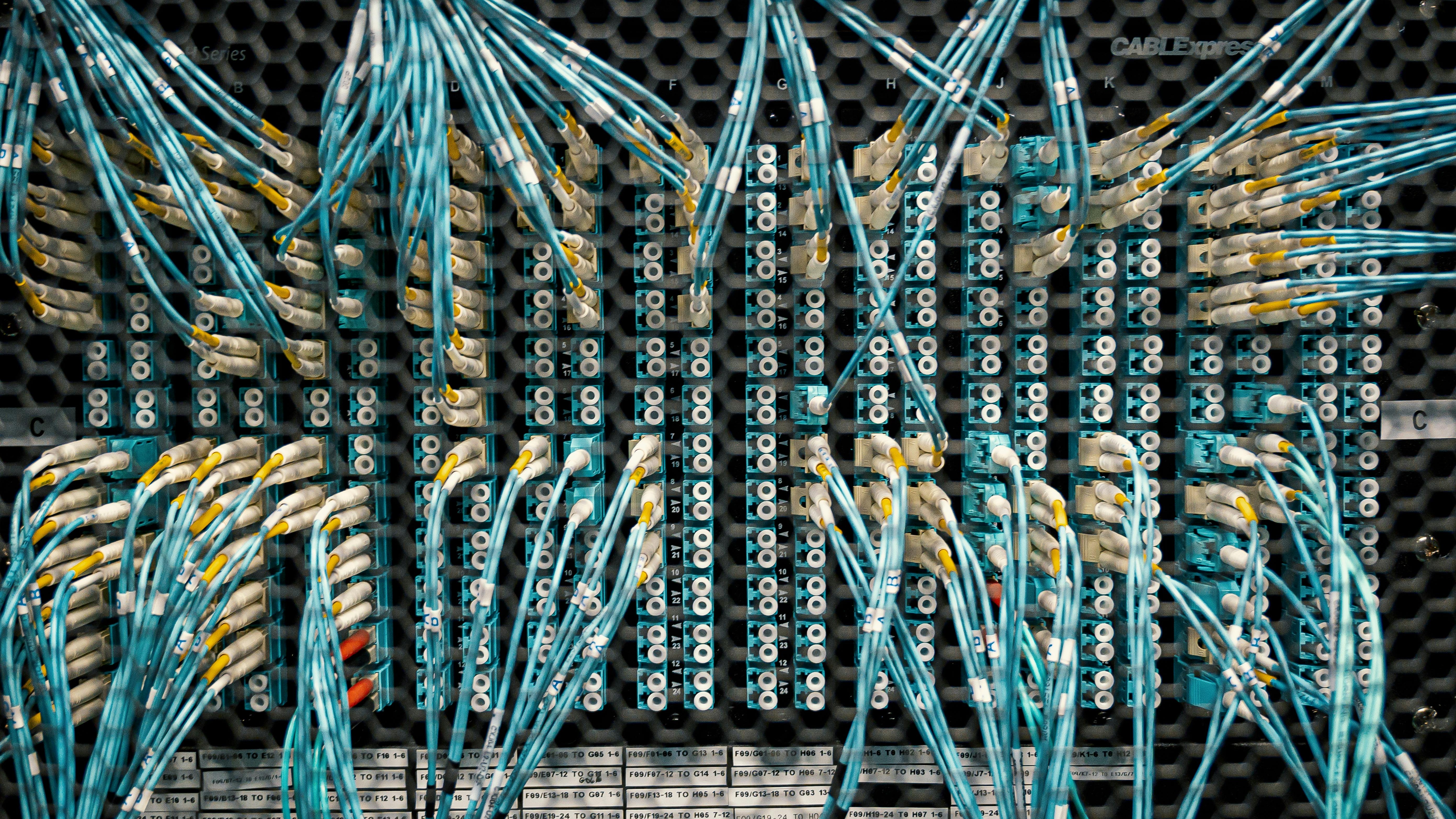 Glowing fiber optic cables in a modern office setting.