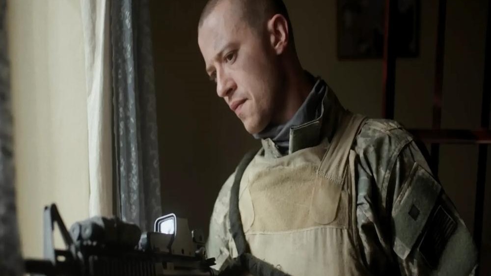 Soldiers in tactical maneuver in urban setting.